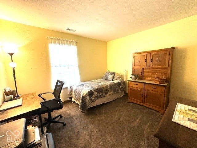 1712 Austin Drive, Lebanon, IN 46052 Carpeted flooring, a window with curtains, and textured walls