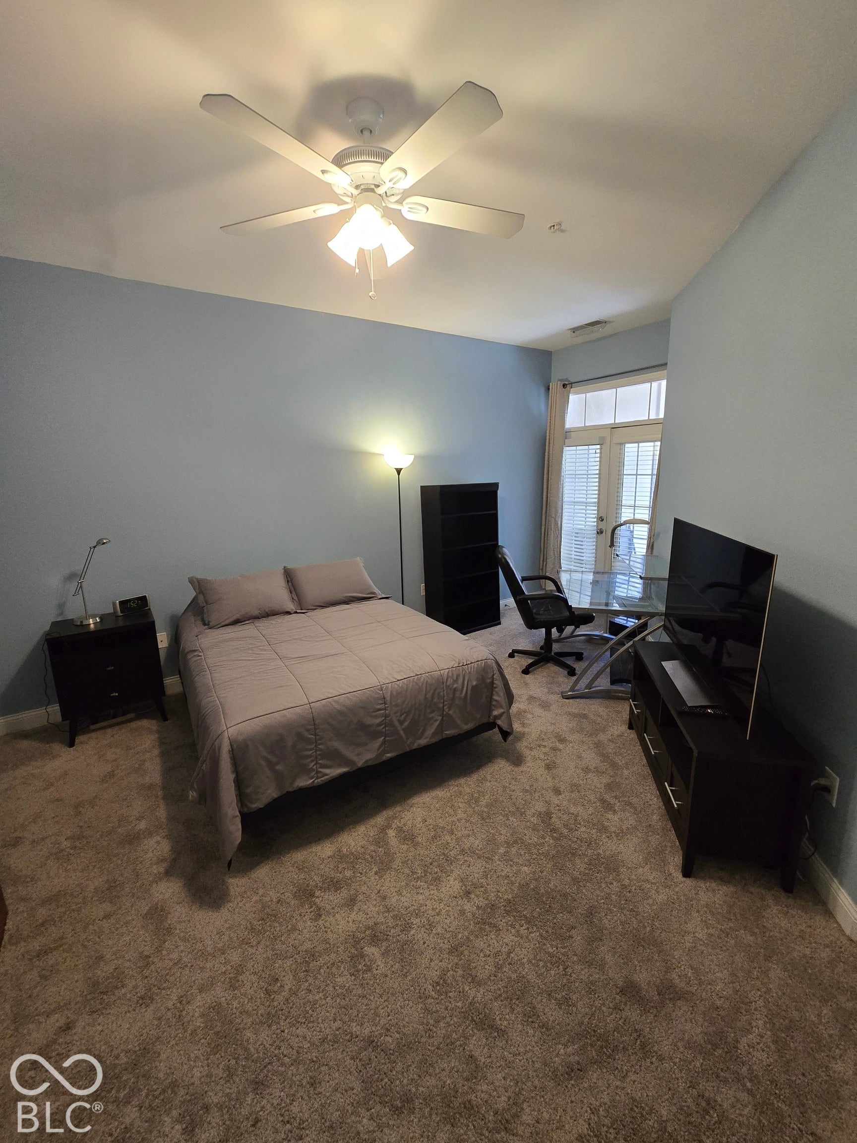 Primary Bedroom Suite with Two Closets, Balcony Access, and Full Bath with Double Vanity, Separate Tub and Shower