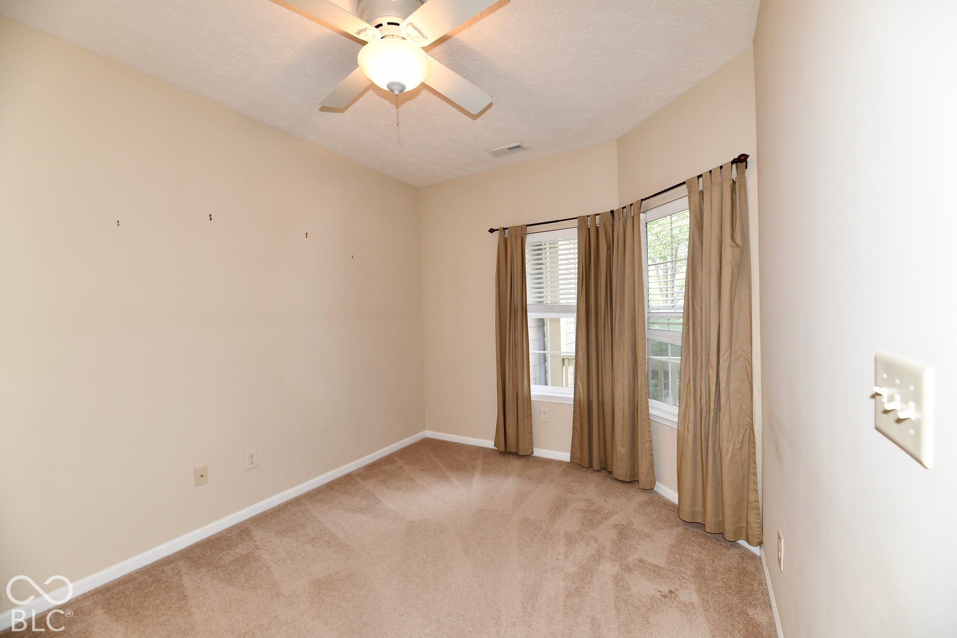 Carpeted Office featuring a ceiling fan and lots of natural light