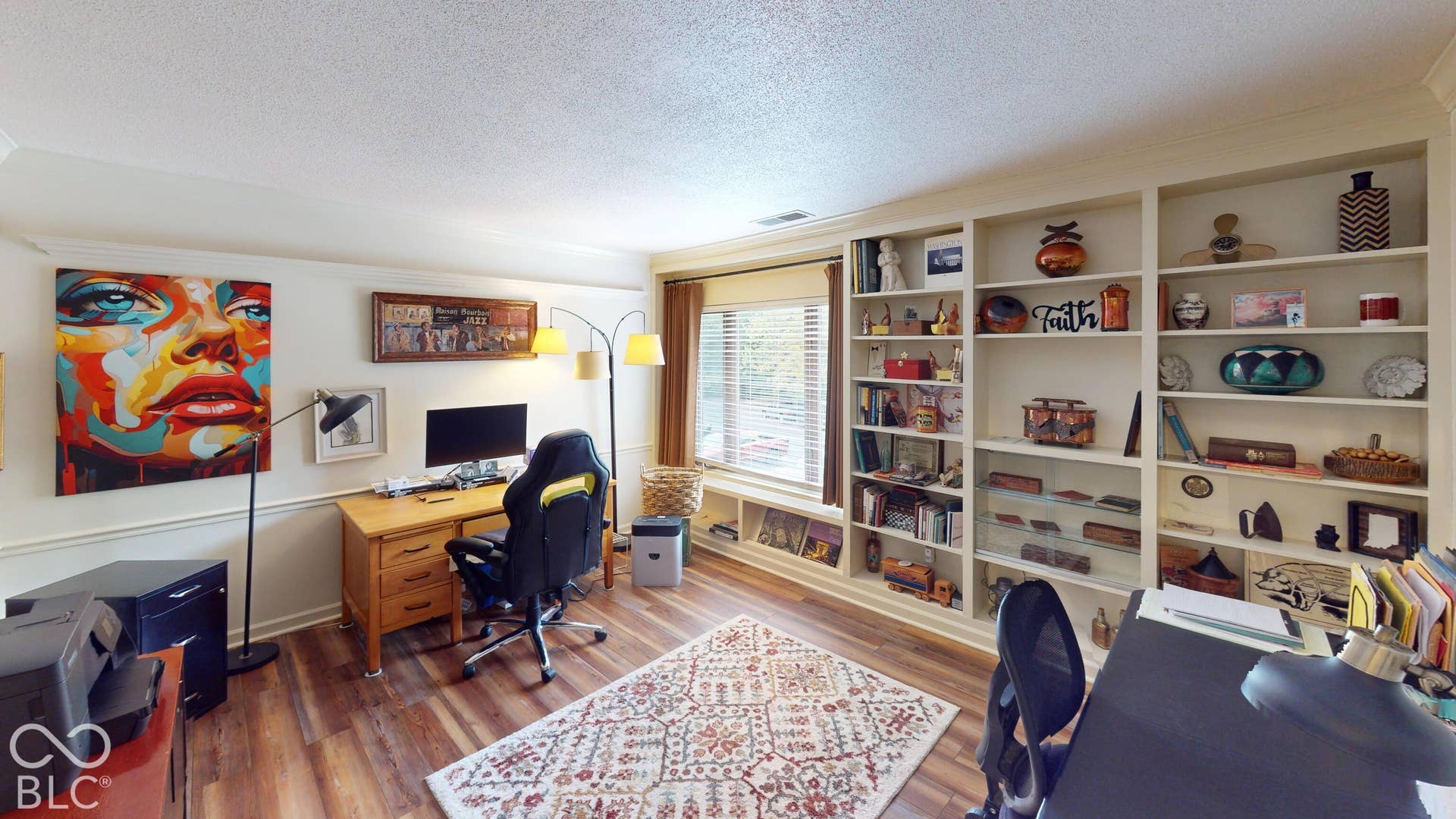 201 Bluffs Circle, Noblesville, IN 46062 BEDROOM #3 | Built-in shelving, wood-finish flooring, crown molding, and a window with horizontal blinds