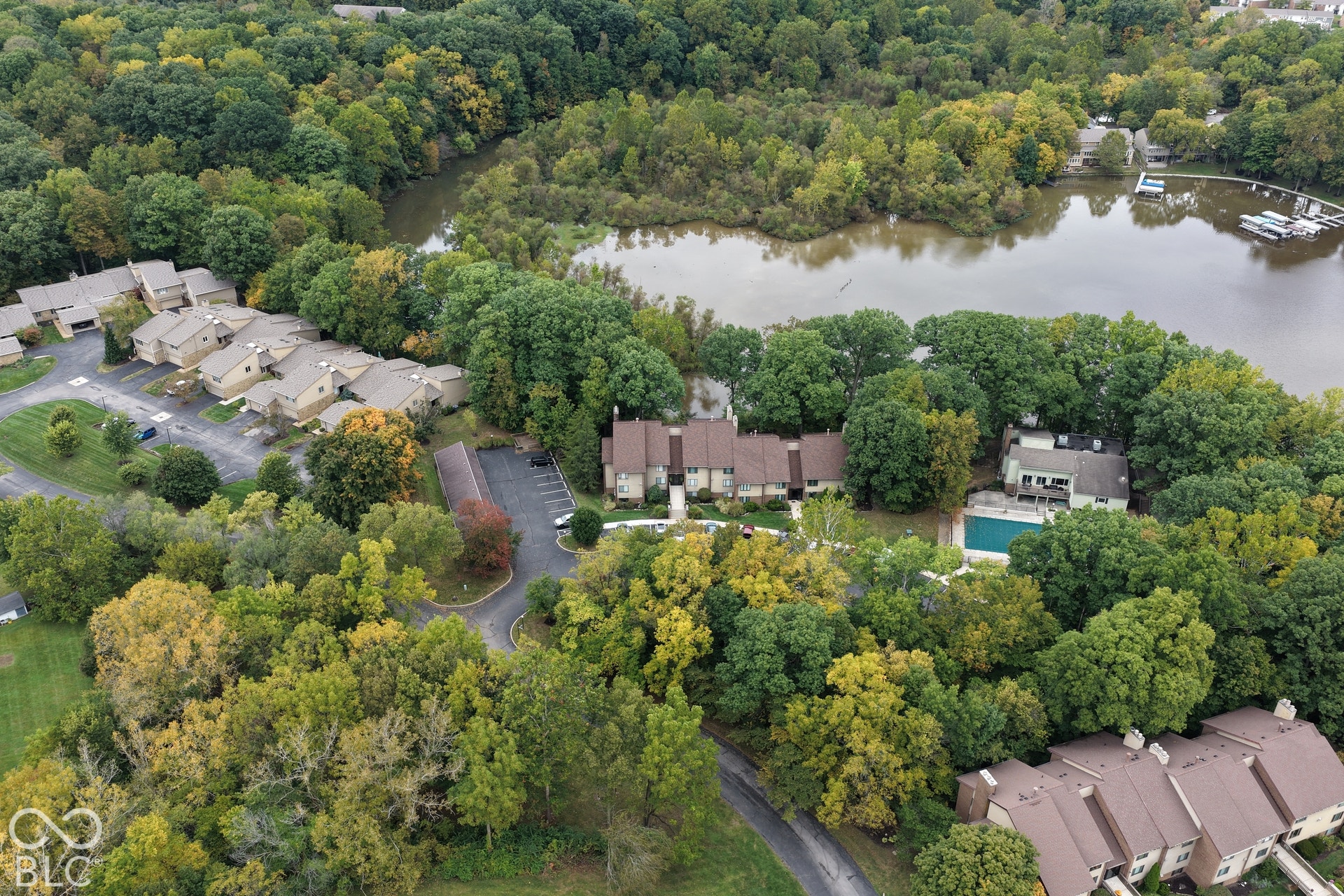 201 Bluffs Circle, Noblesville, IN 46062 Waterfront property with private boat slips, community pool, and mature trees