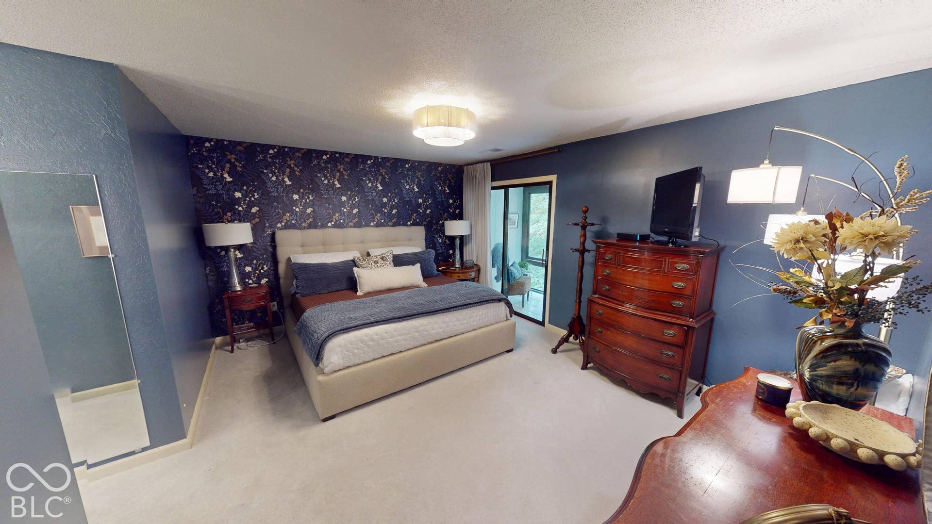 201 Bluffs Circle, Noblesville, IN 46062 BEDROOM #1 | *Primary Bedroom & bathroom & suite | Carpeted flooring with a neutral color palette, accent wall with decorative wallpaper, and sliding glass door