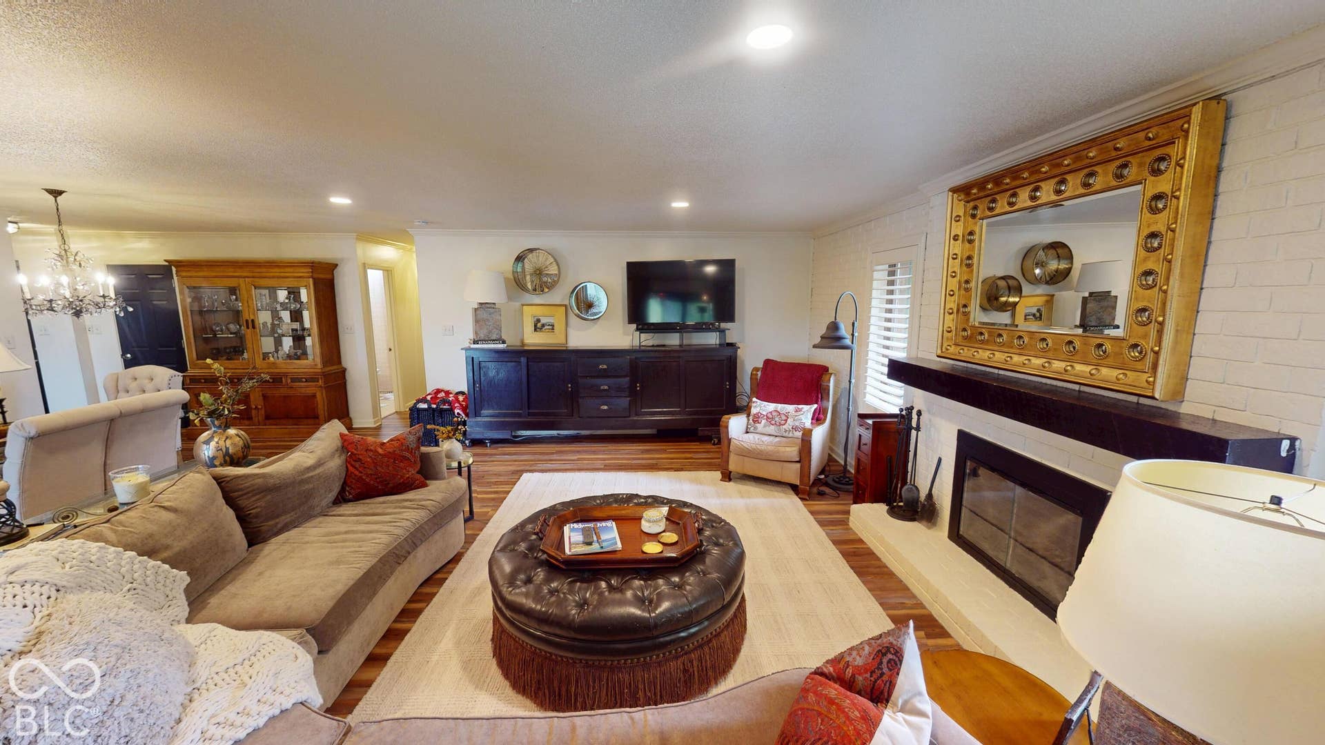 201 Bluffs Circle, Noblesville, IN 46062 Wood-finish flooring, recessed lighting, and a built-in fireplace with a hearth