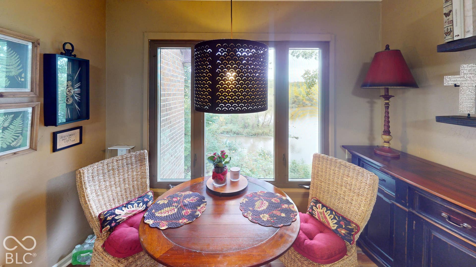 201 Bluffs Circle, Noblesville, IN 46062 Wood-finish corner dining table with a pendant light fixture | Breakfast nook area or even a potential for small office or sitting area.