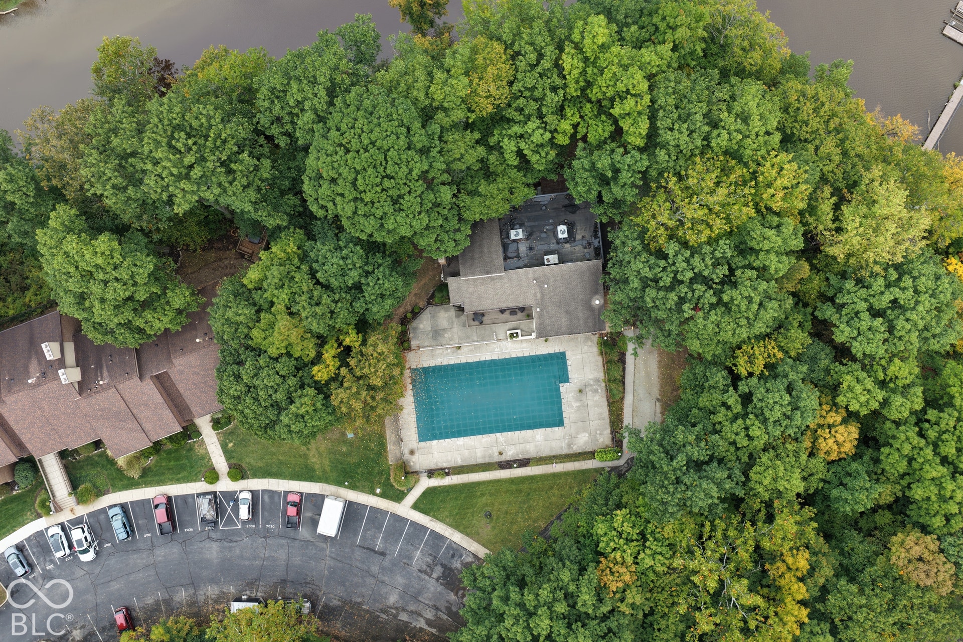 201 Bluffs Circle, Noblesville, IN 46062 Outdoor swimming pool with surrounding concrete patio and adjacent building