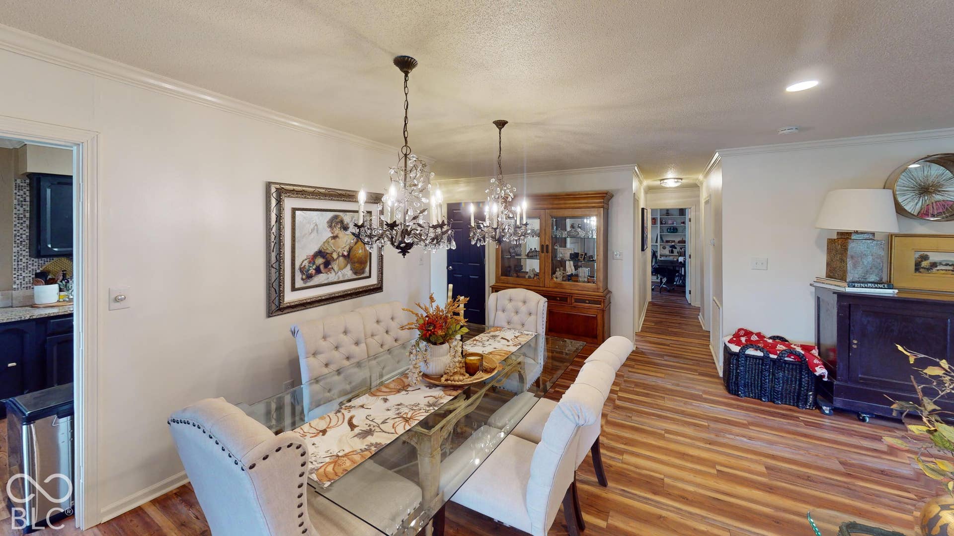 201 Bluffs Circle, Noblesville, IN 46062 Wood-finish flooring, crown molding, and two chandelier light fixtures