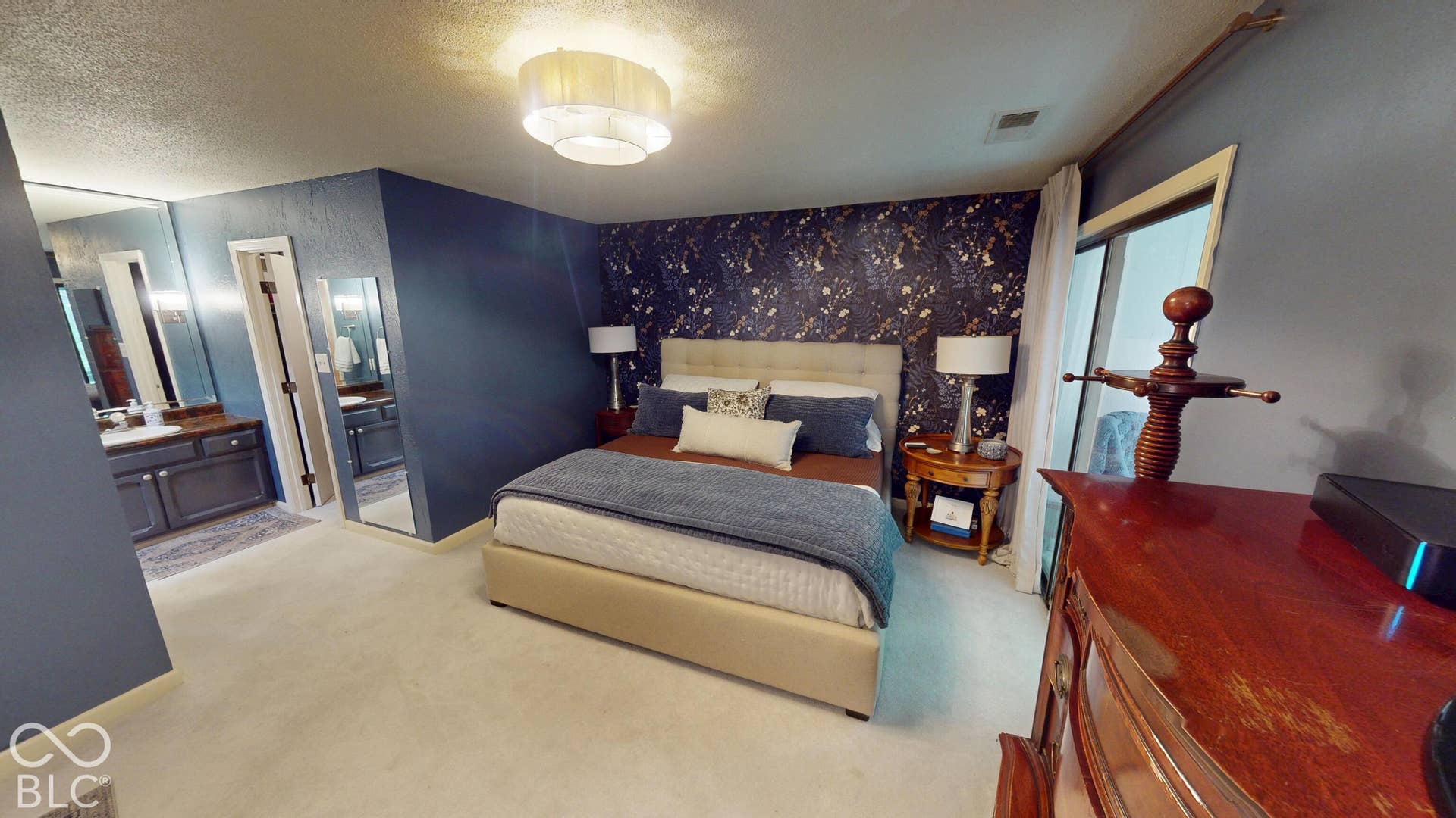 201 Bluffs Circle, Noblesville, IN 46062 BEDROOM #1 | *Primary Bedroom & bathroom & suite | Bedroom featuring patterned accent wall, neutral carpeting, and a modern ceiling light fixture