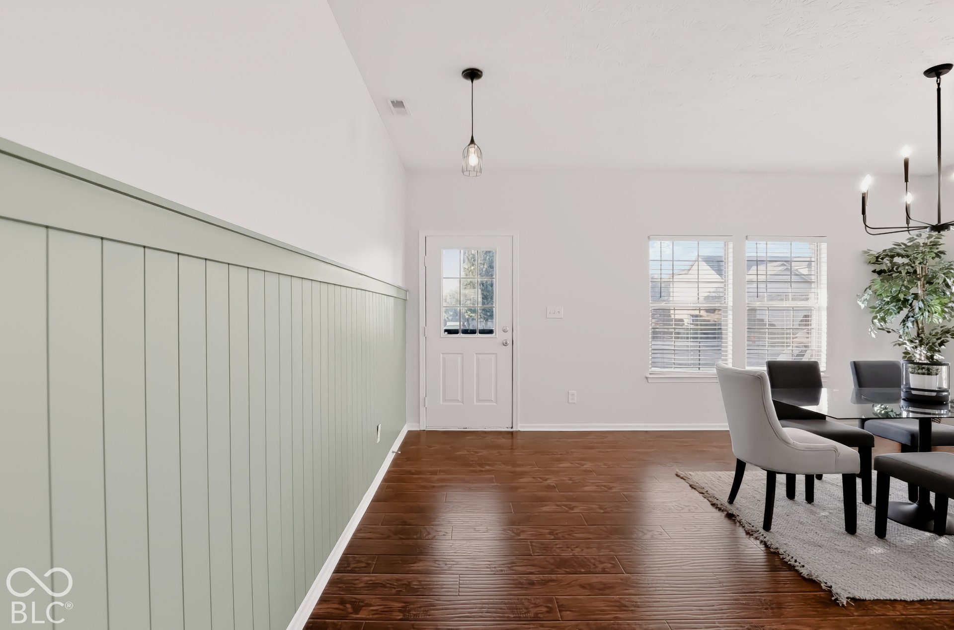 Look at the recently updated earthy shiplap accent added to the entry!