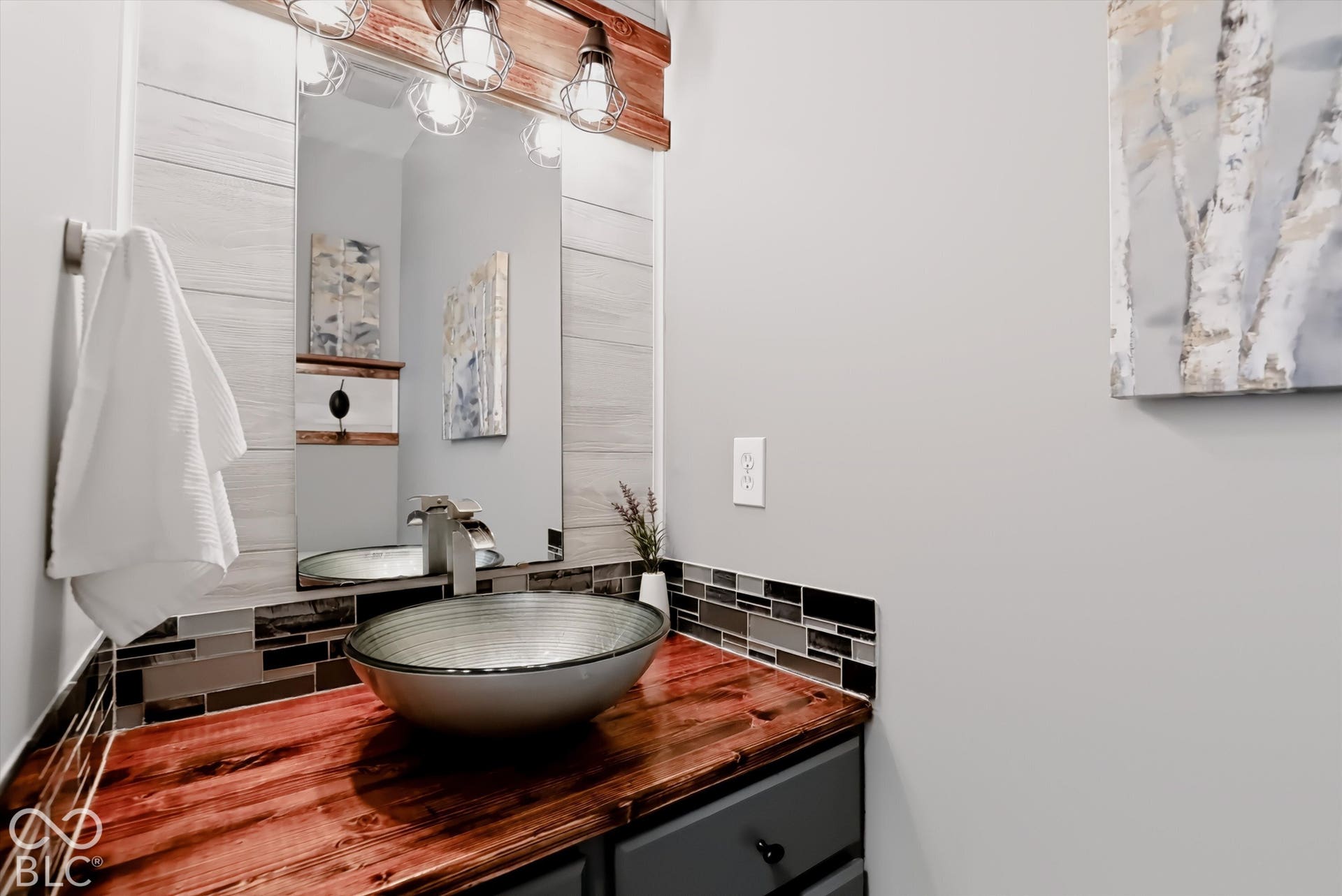 Guest bath is tastefully updated.