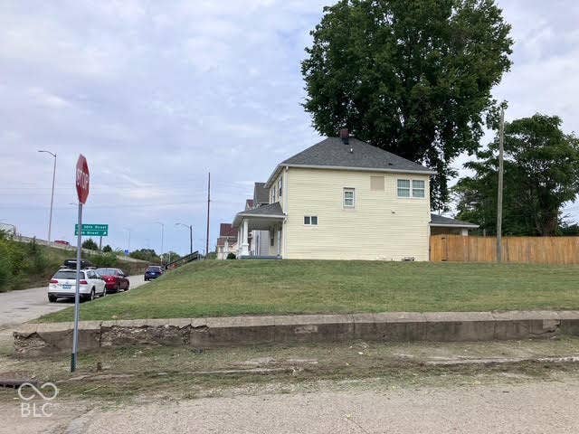 2701 Shriver Avenue, Indianapolis, IN 46208 Expansive grassy lot on a city corner with existing concrete curb