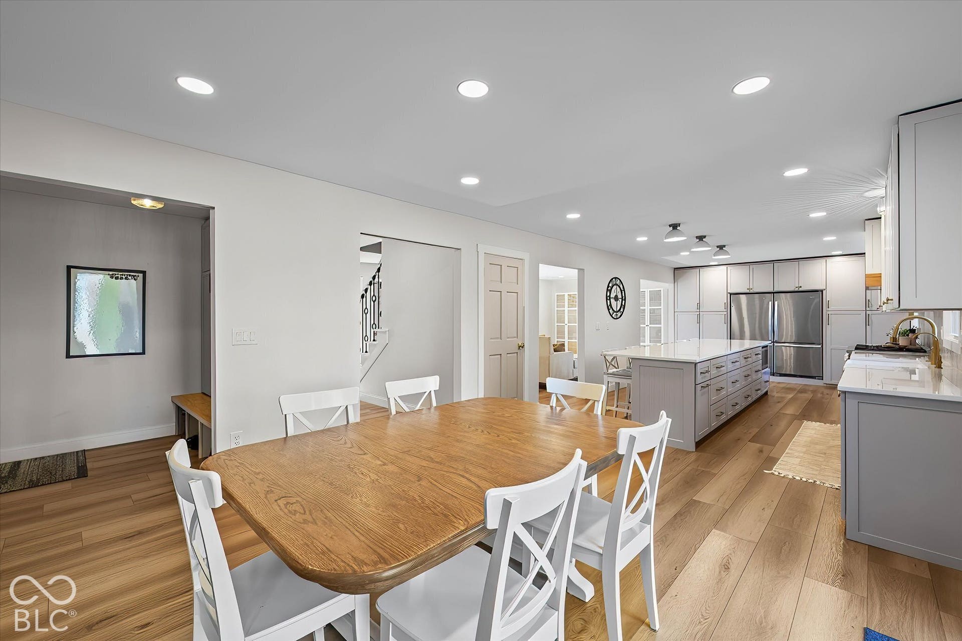 Wow! Huge open kitchen with entire wall of pantry, pull-out drawers, and a 13 ft Island! Mudroom w/ storage lockers off kitchen