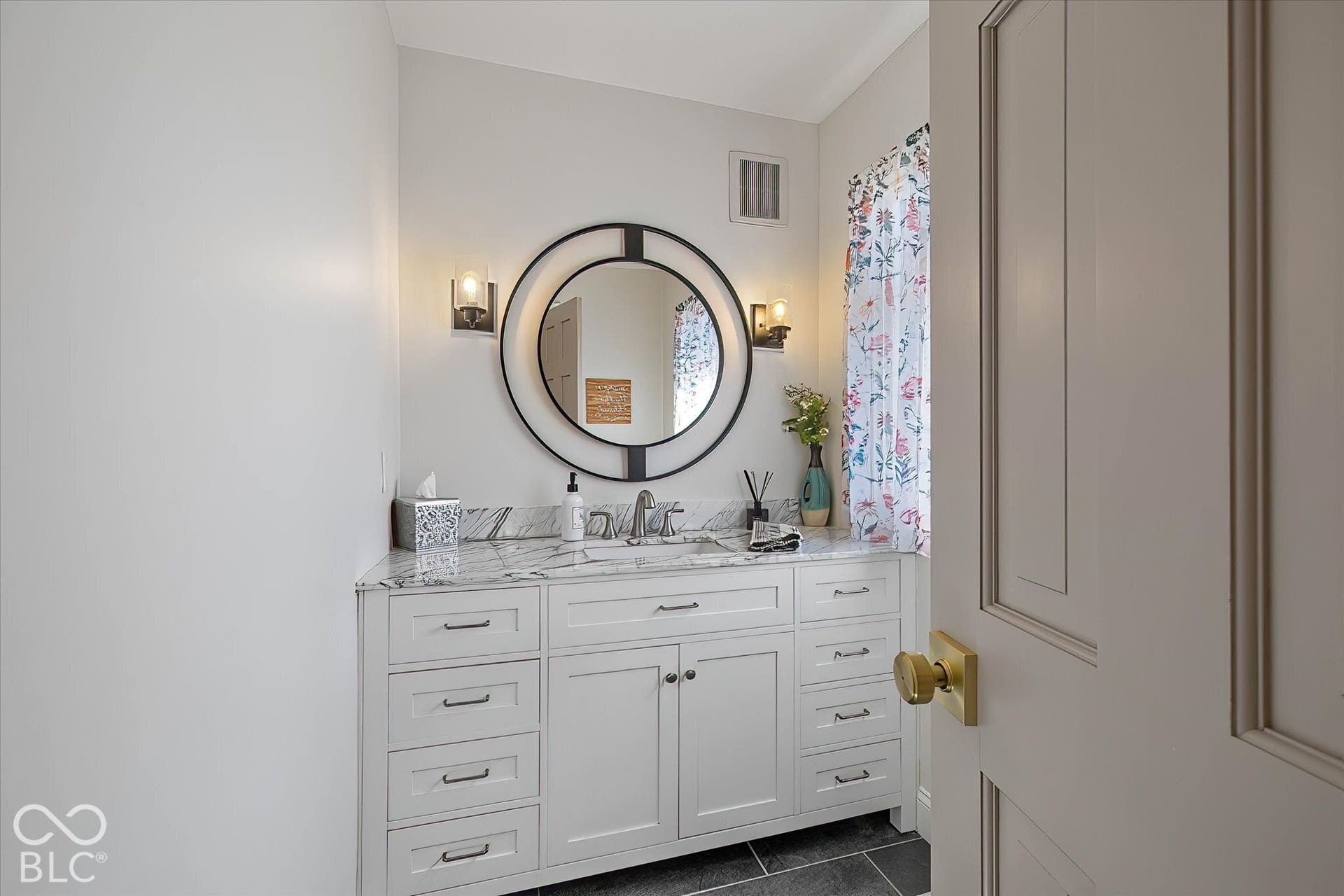 Updated Half Bath off entryway - beautiful tile, vanity, lighting!