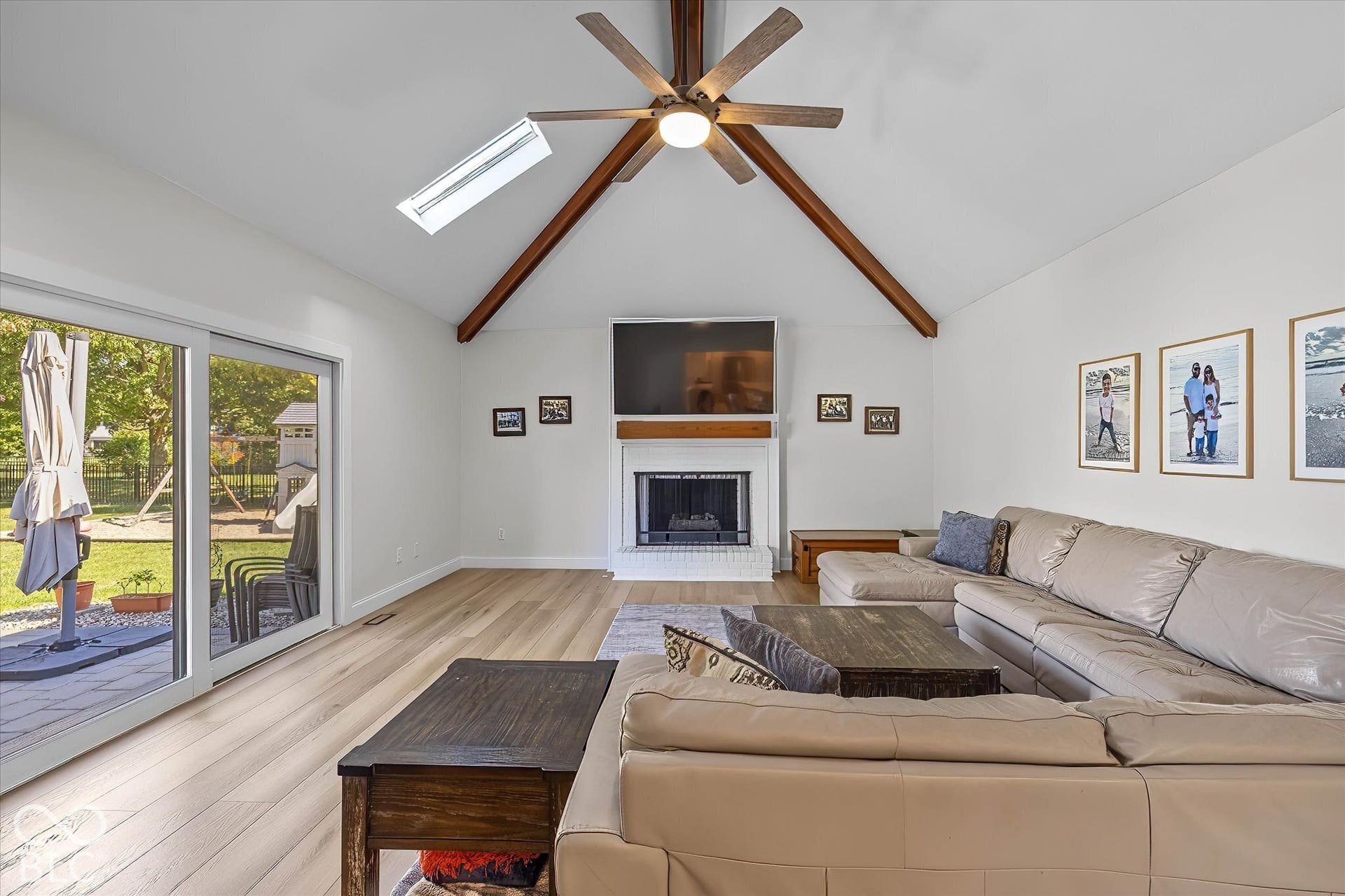 Stunning Family room w/ high ceilings + beams, Fireplace updated! Access and view to backyard space