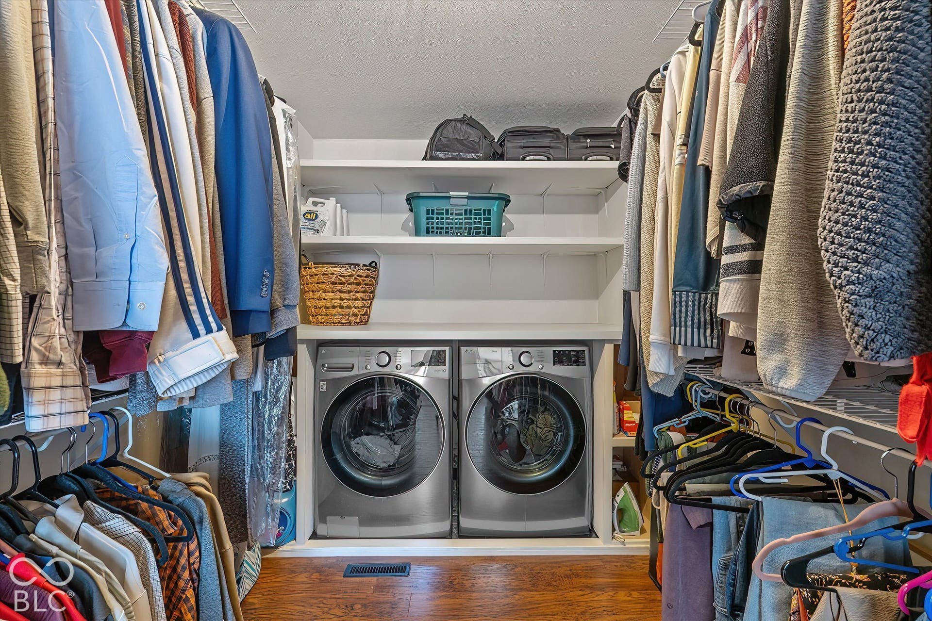 Owners' Closet space with convenient laundry - Shelving, Full waterproofed floor pan w/ drain.