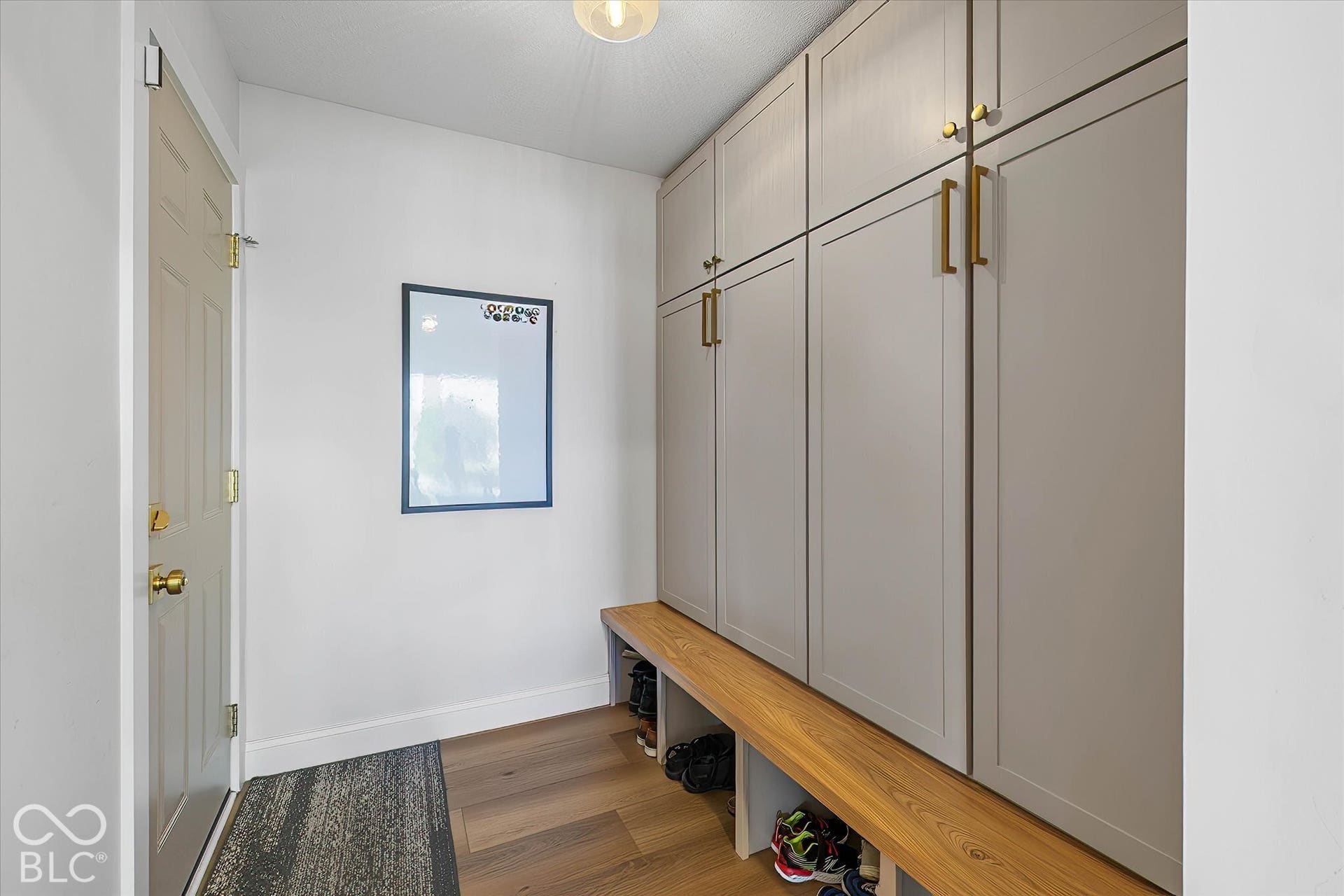 Great mudroom w/ so much storage space in cabinets and bins