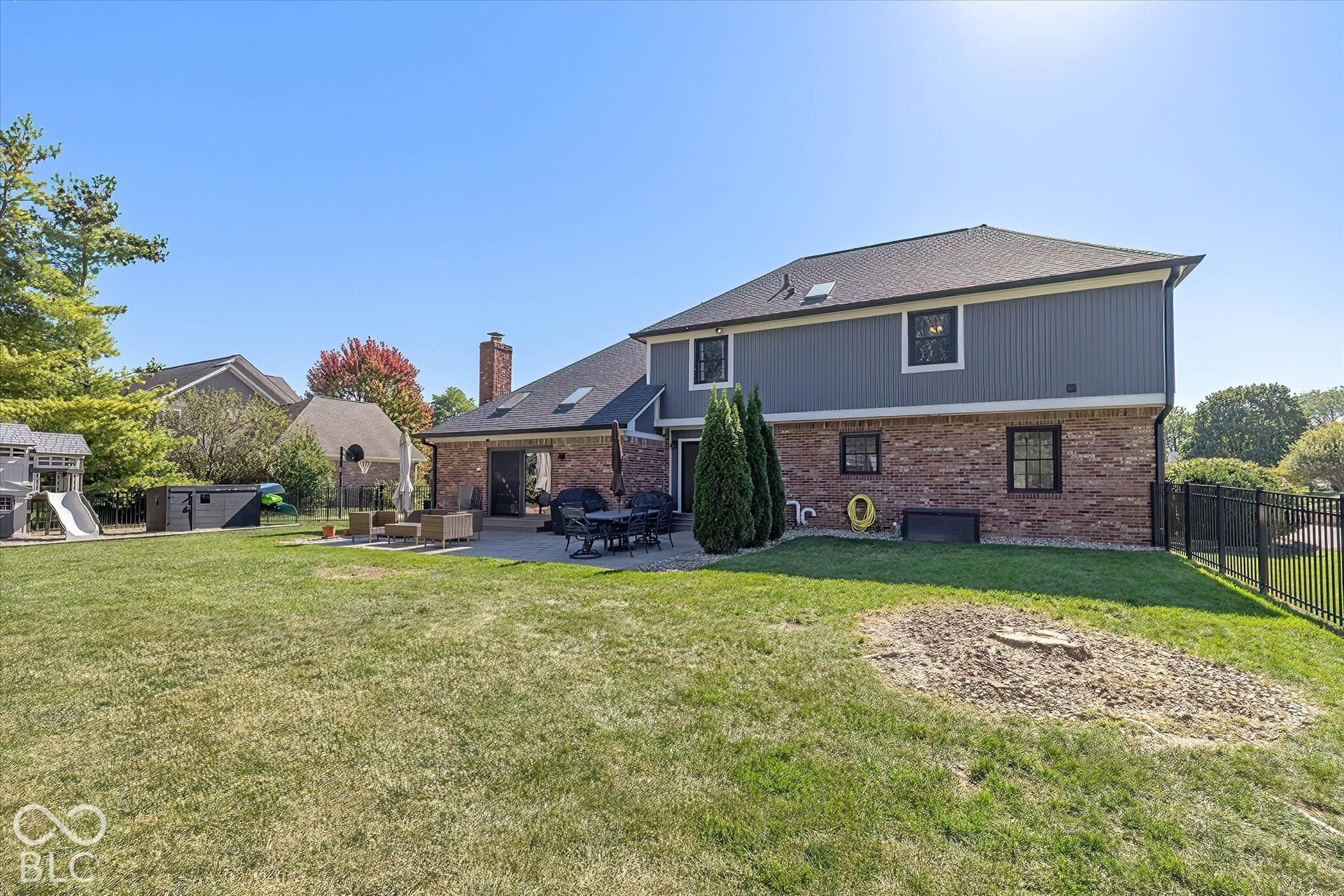 Fenced yard w/ playspace, Huge paver patio, Brick Storage 10x12 building.