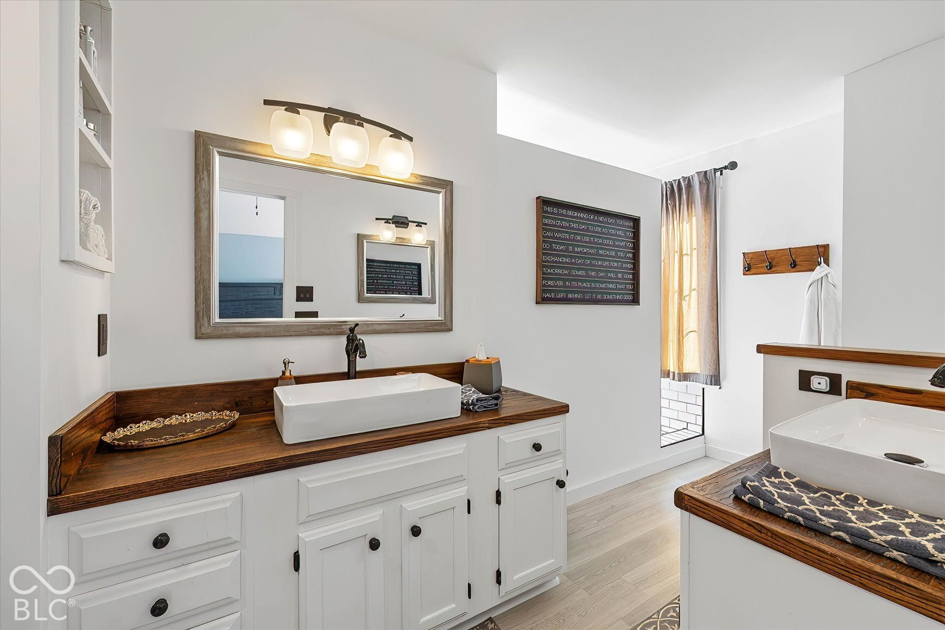 Owners' bathroom retreat - double sinks, shelving, and giant walk-in shower!