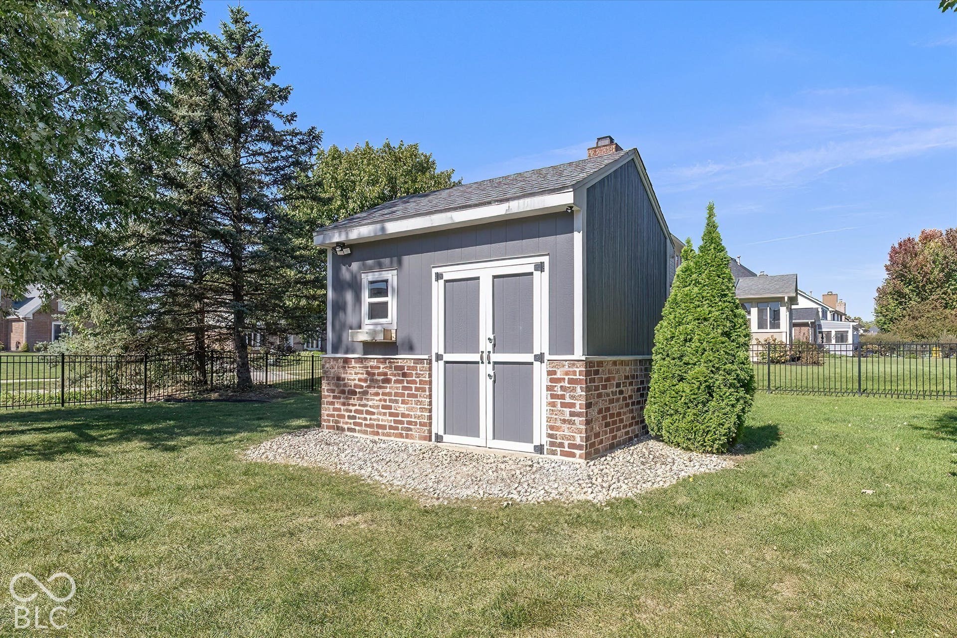 Brick Storage shed, 10x12 w/ French drain behind structure. Mature Trees.