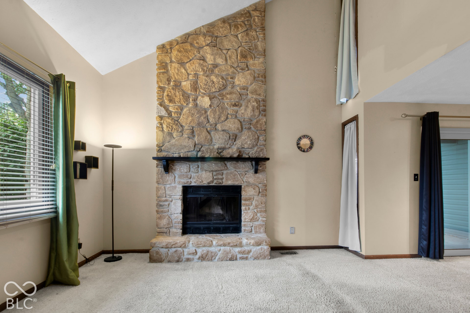 Floor to ceiling stone fireplace
