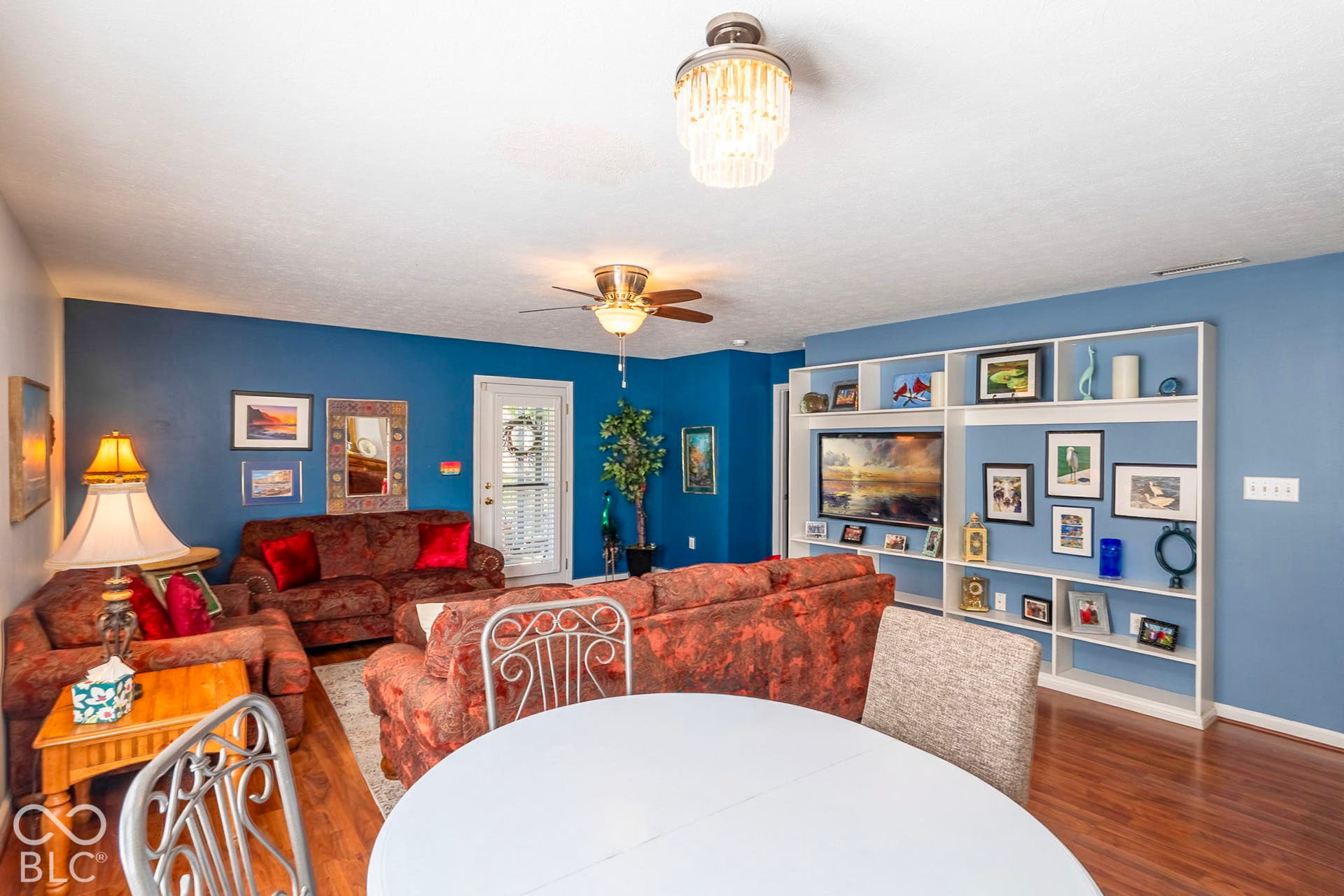 Wood-finish flooring throughout, integrated ceiling fan, and recessed lighting