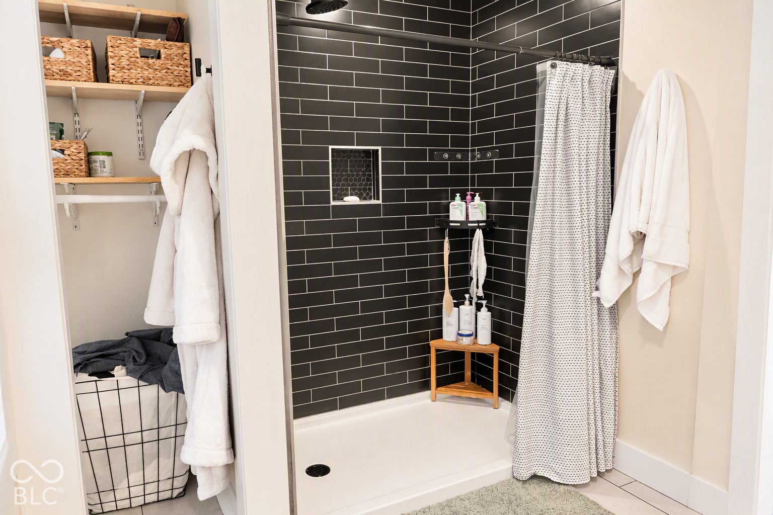 Shower featuring dark subway tile