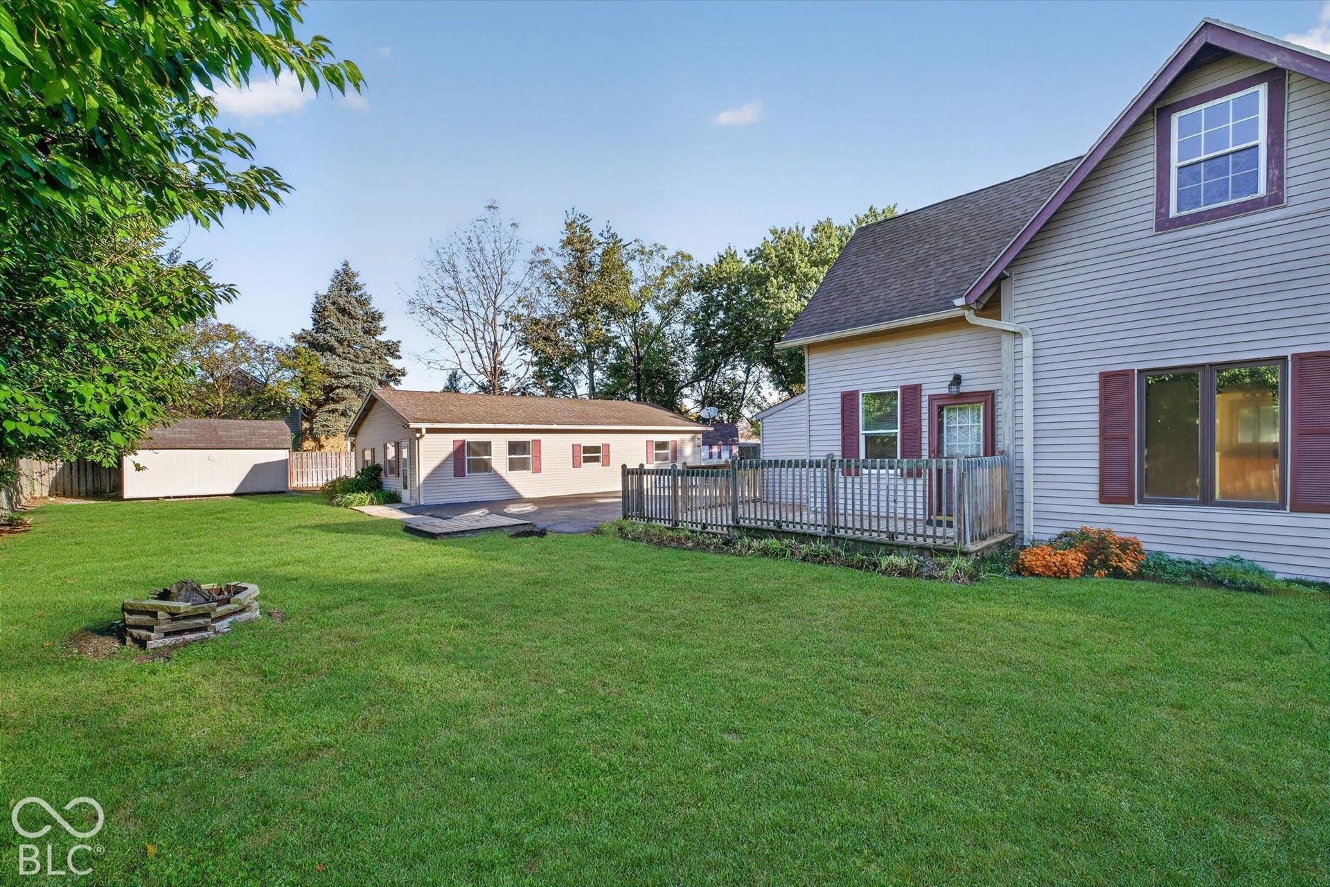 8404 Union Chapel Road, Indianapolis, IN 46240 Expansive green lawn, gardens, additional outbuilding, and fire pit