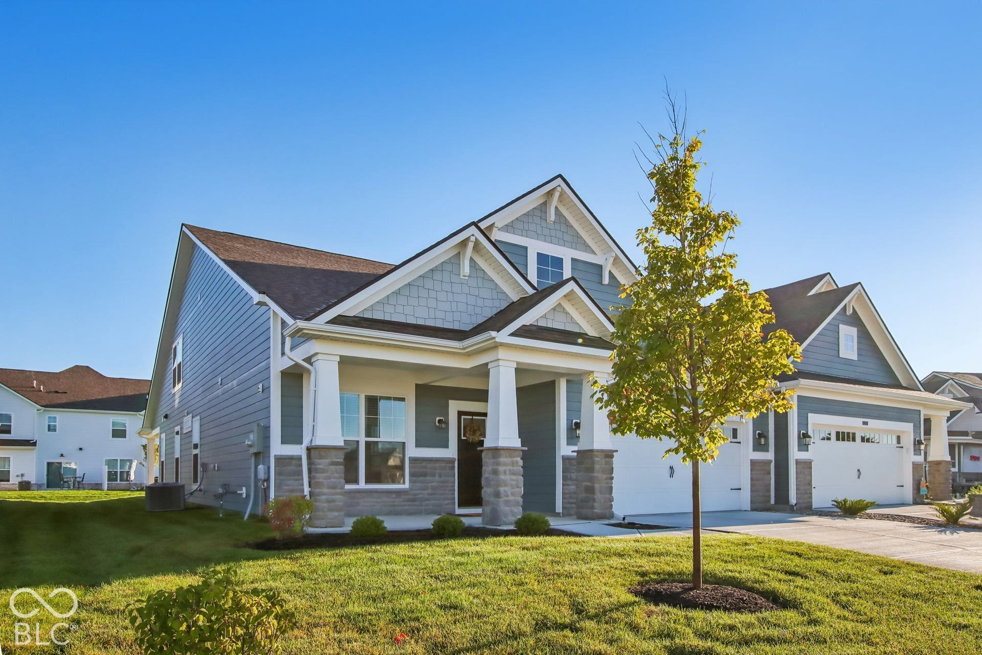 Craftsman-style exterior with siding and stone accents