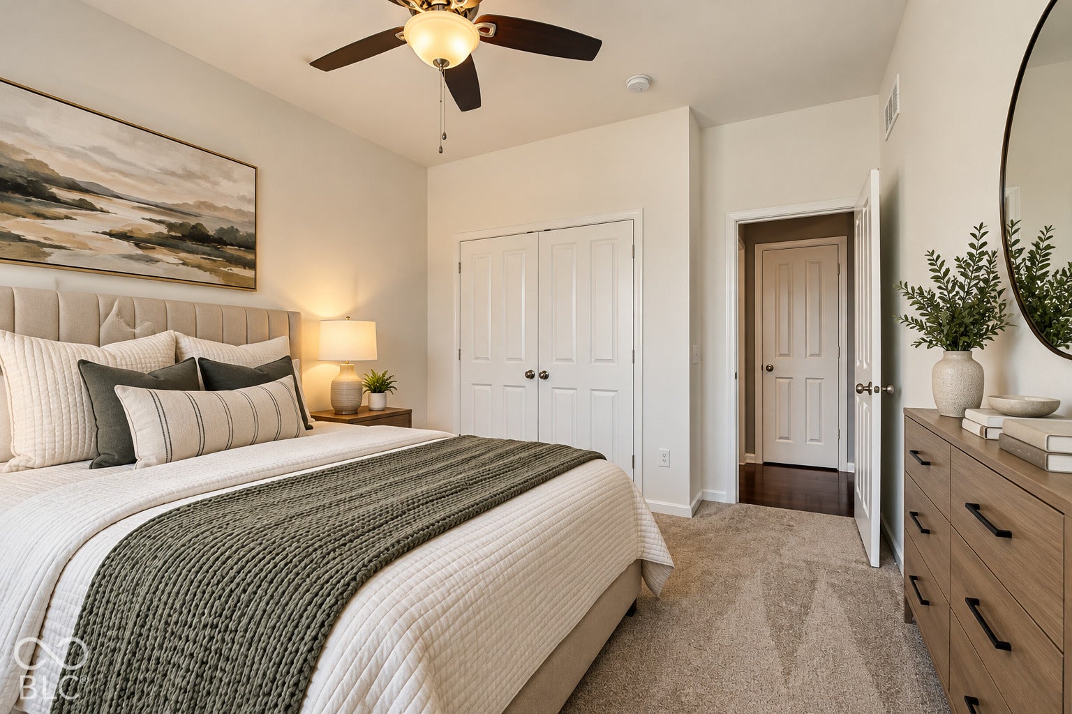 Plush carpet flooring, ceiling fan with integrated lighting, paneled bifold closet doors, and a paneled interior door