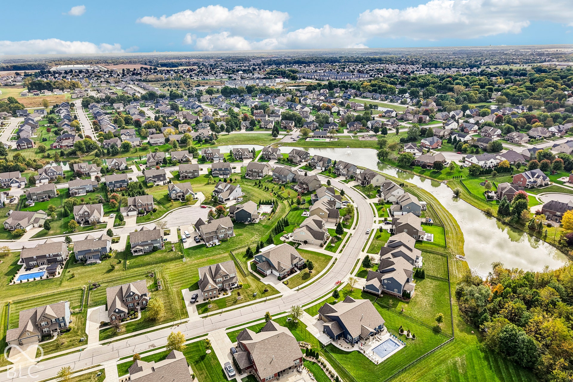 Residential neighborhood with tree-lined streets, multiple cul-de-sacs, and homes featuring private swimming pools