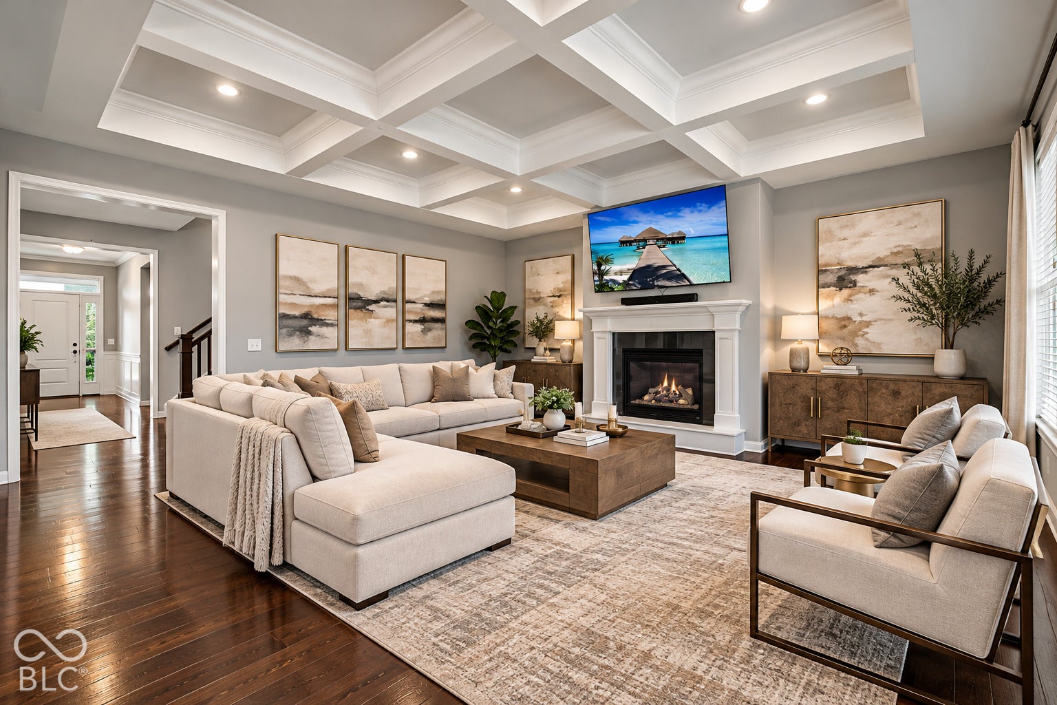 Coffered ceiling with recessed lighting, hardwood flooring, fireplace with a mantel, and architectural archways