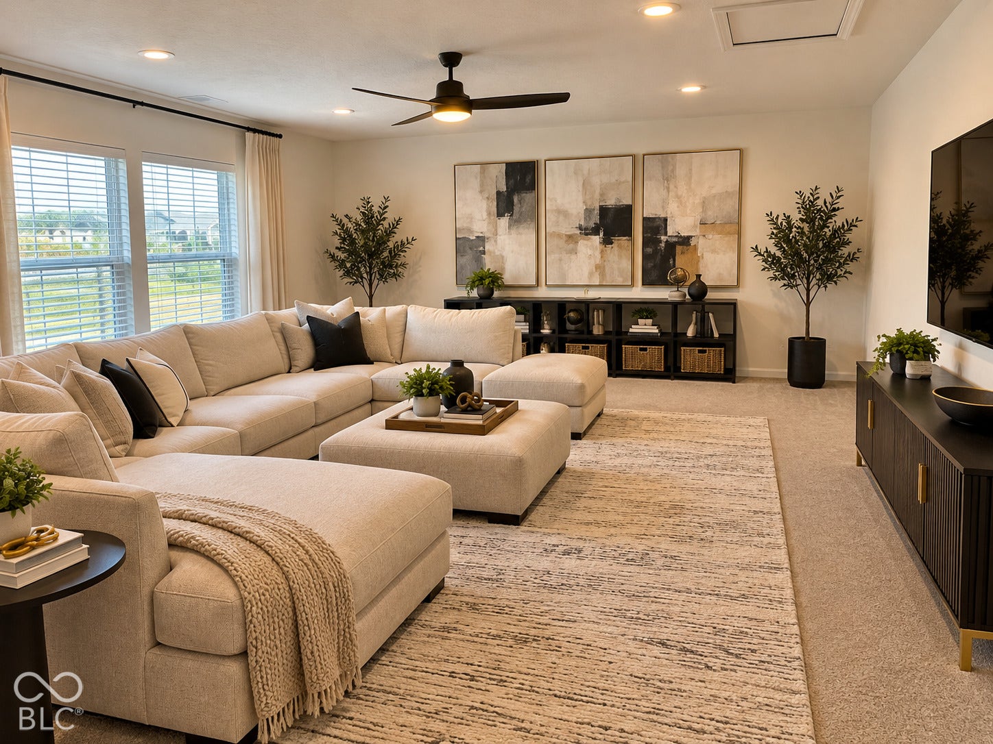 Recessed lighting, ceiling fan, multiple windows, and carpeted flooring