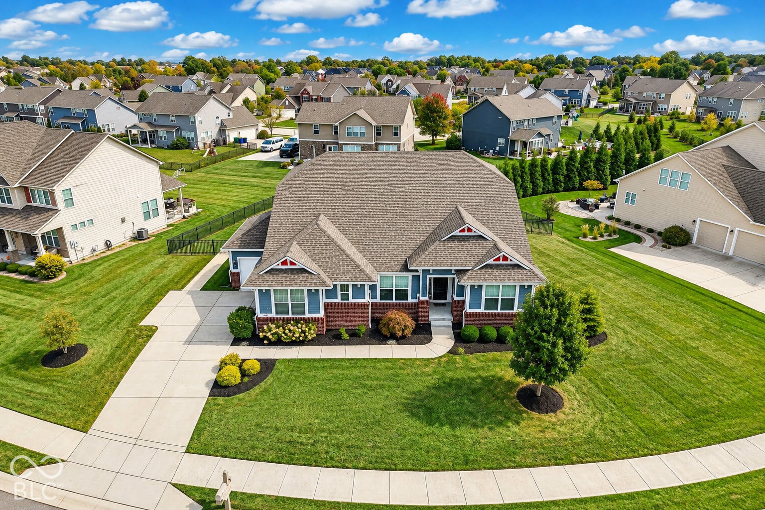 Brick and siding exterior with decorative gables