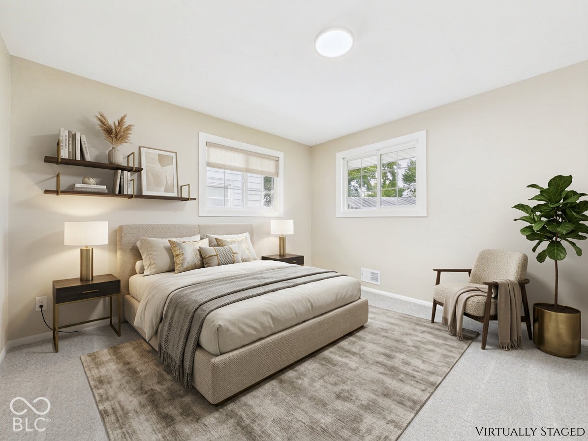 Recessed lighting, light-toned wall finishes, two windows with blinds, and built-in wall shelving