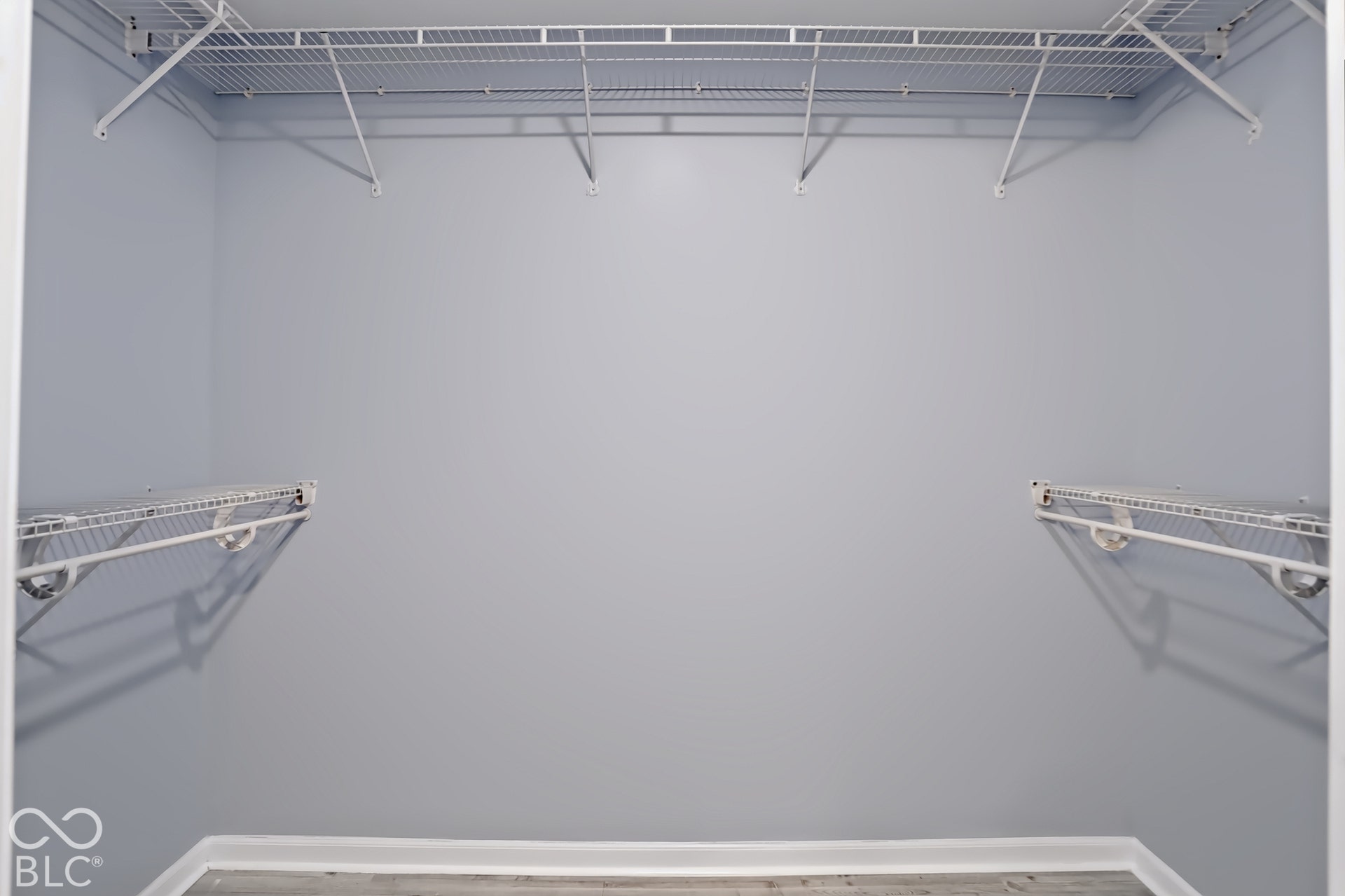 Primary bedroom walk-in closet