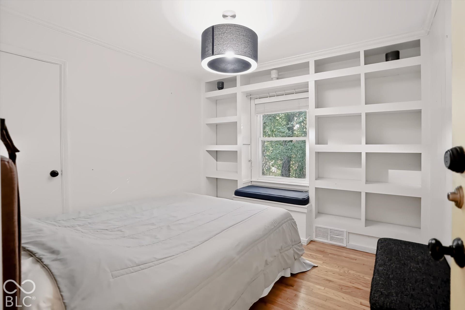 Built-in shelving surrounding a window seat