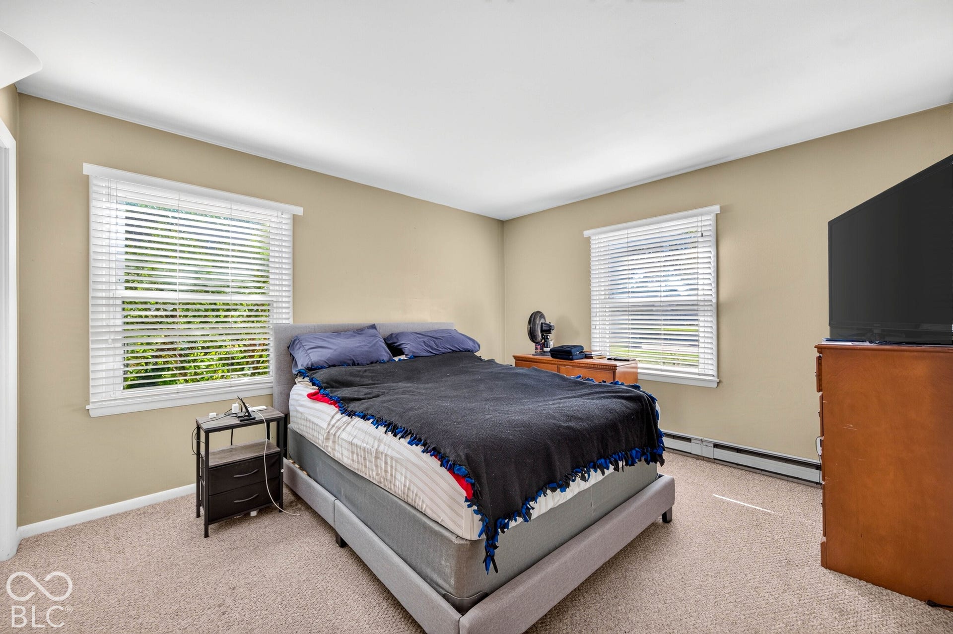 Room with neutral wall color and carpeted flooring
