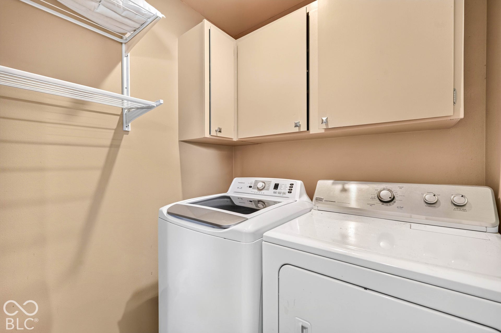Upper cabinetry with hardware and white wire shelving