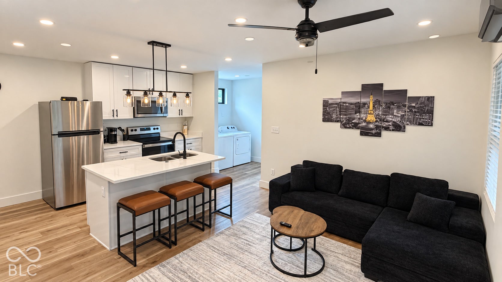 Open concept living area featuring wood-finish flooring, recessed lighting, and a ceiling fan