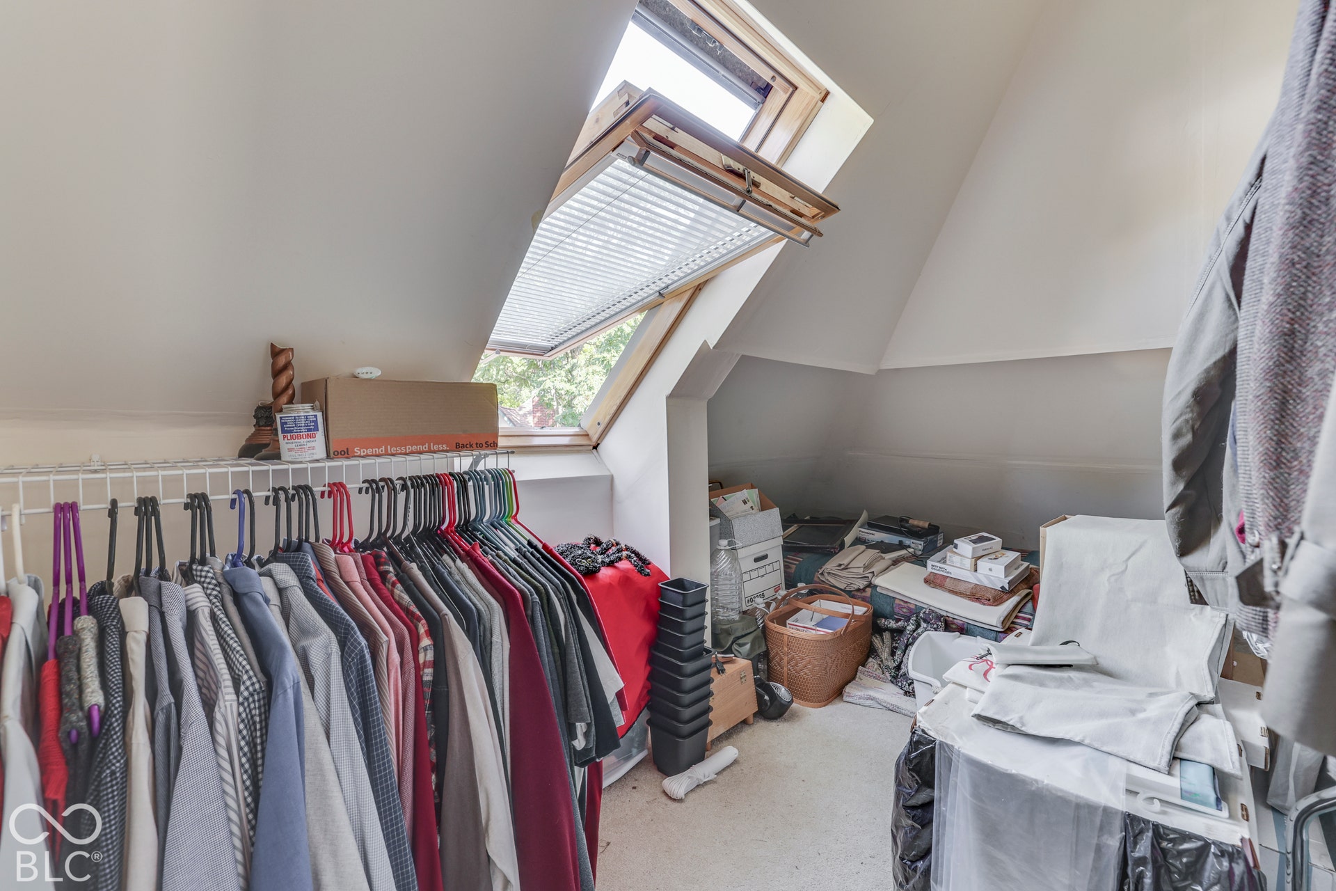 Sloped ceilings with a skylight in attic.