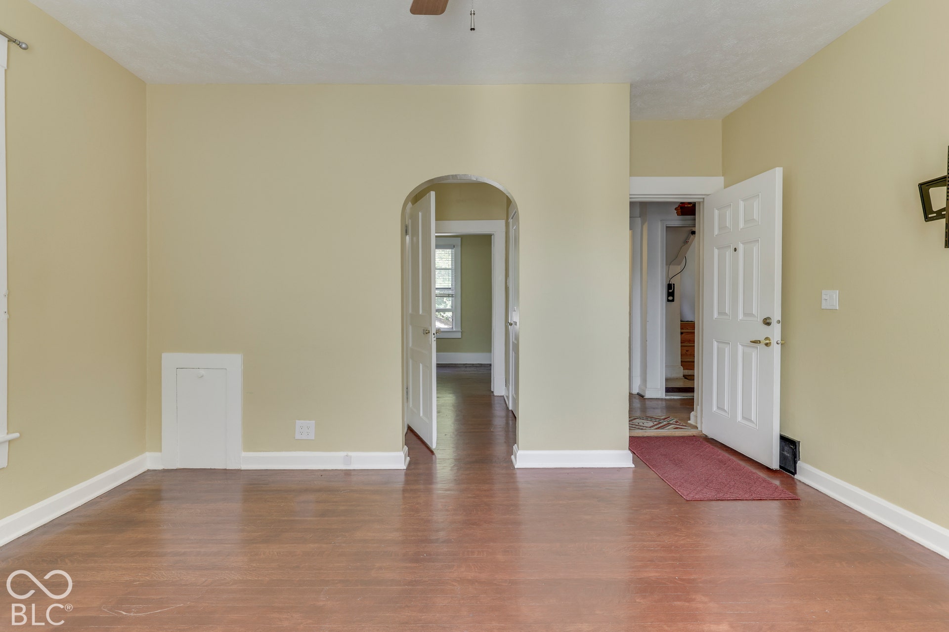 Unit 3 Hardwood flooring and arched doorway