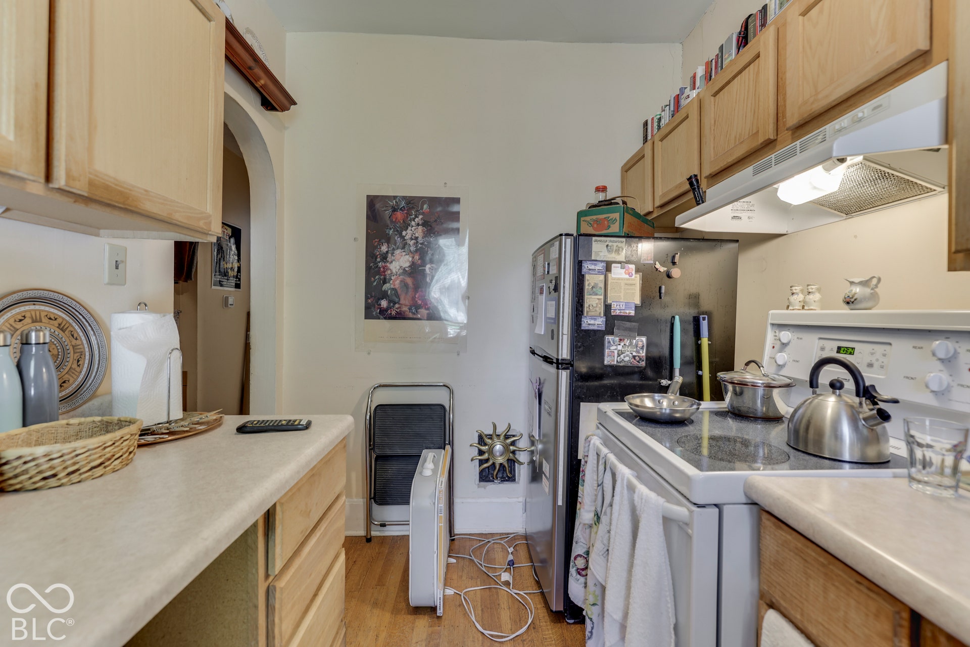Unit 4 Wood-finish cabinetry paired with light-toned countertops