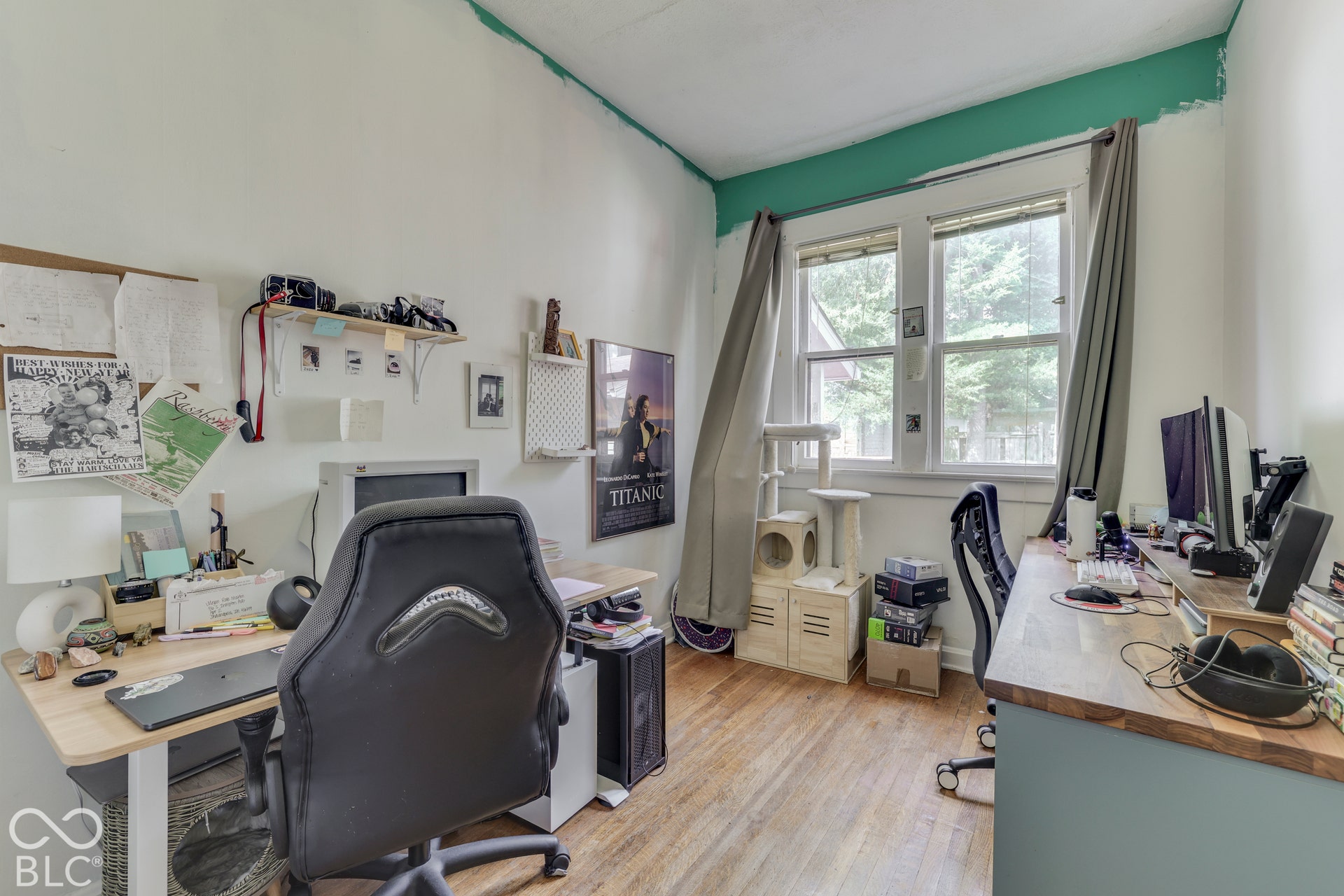 Unit 2 Hardwood flooring, painted walls, and windows with natural light
