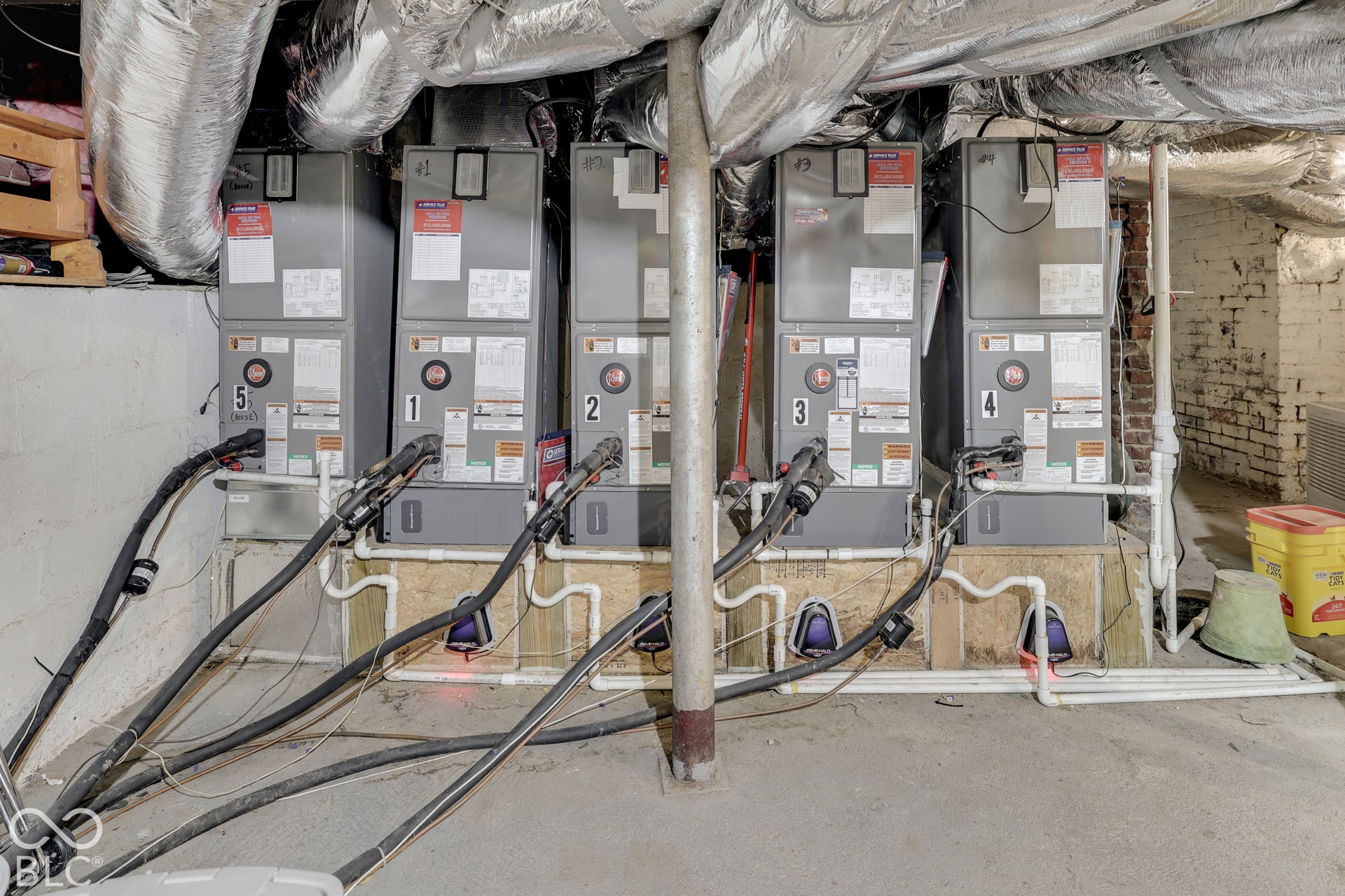 Multiple HVAC units with associated ductwork and piping