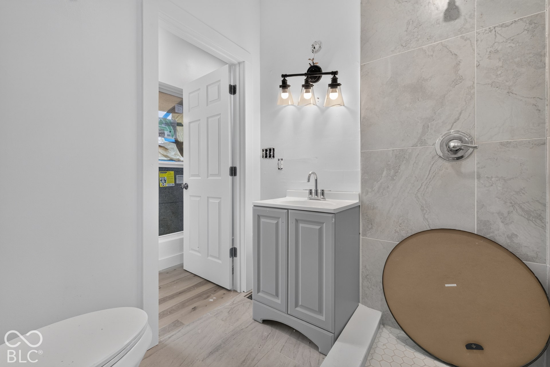 Modern vanity with a white countertop and base cabinet