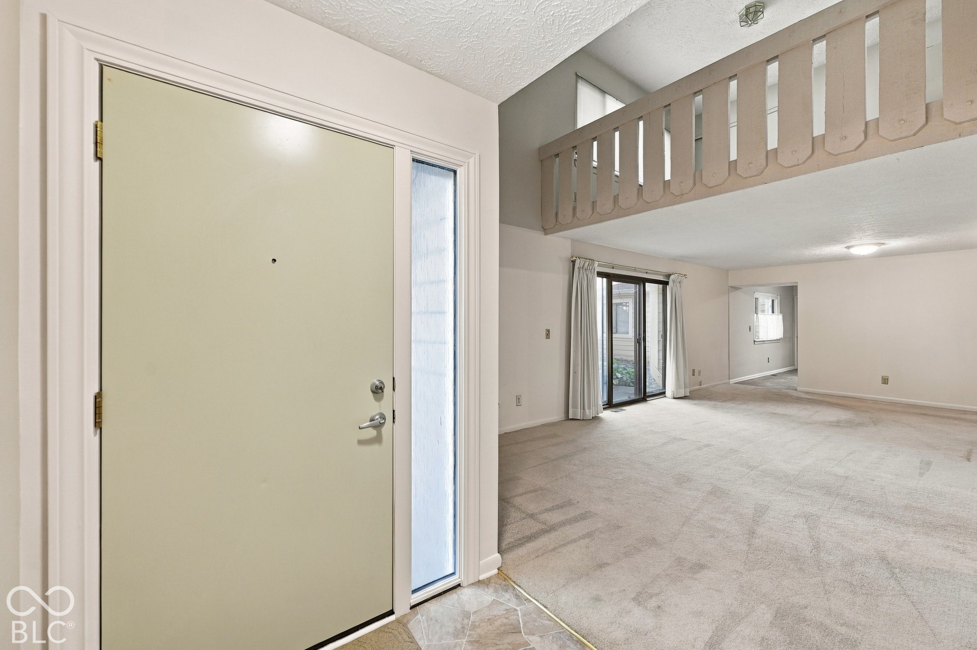 Entry with sidelight and tiled flooring