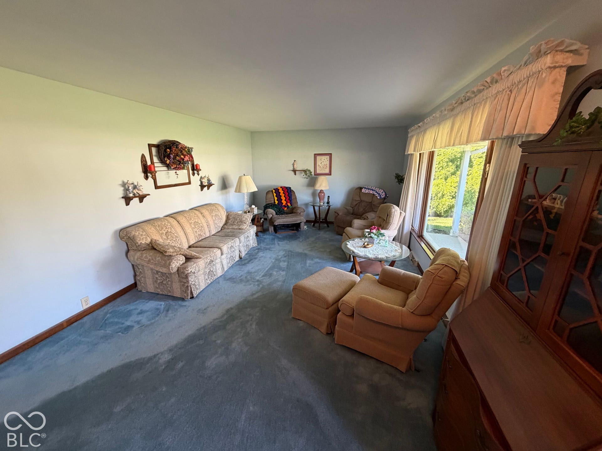 Wall-to-wall carpeting and neutral wall paint