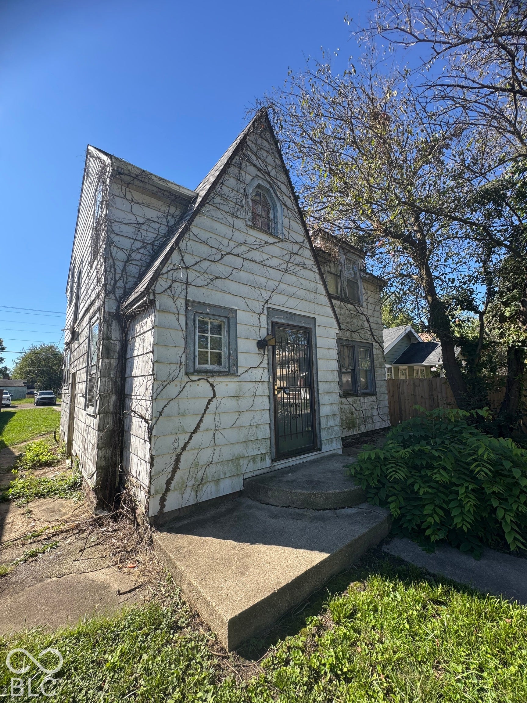Gabled roofline with arched window detailing