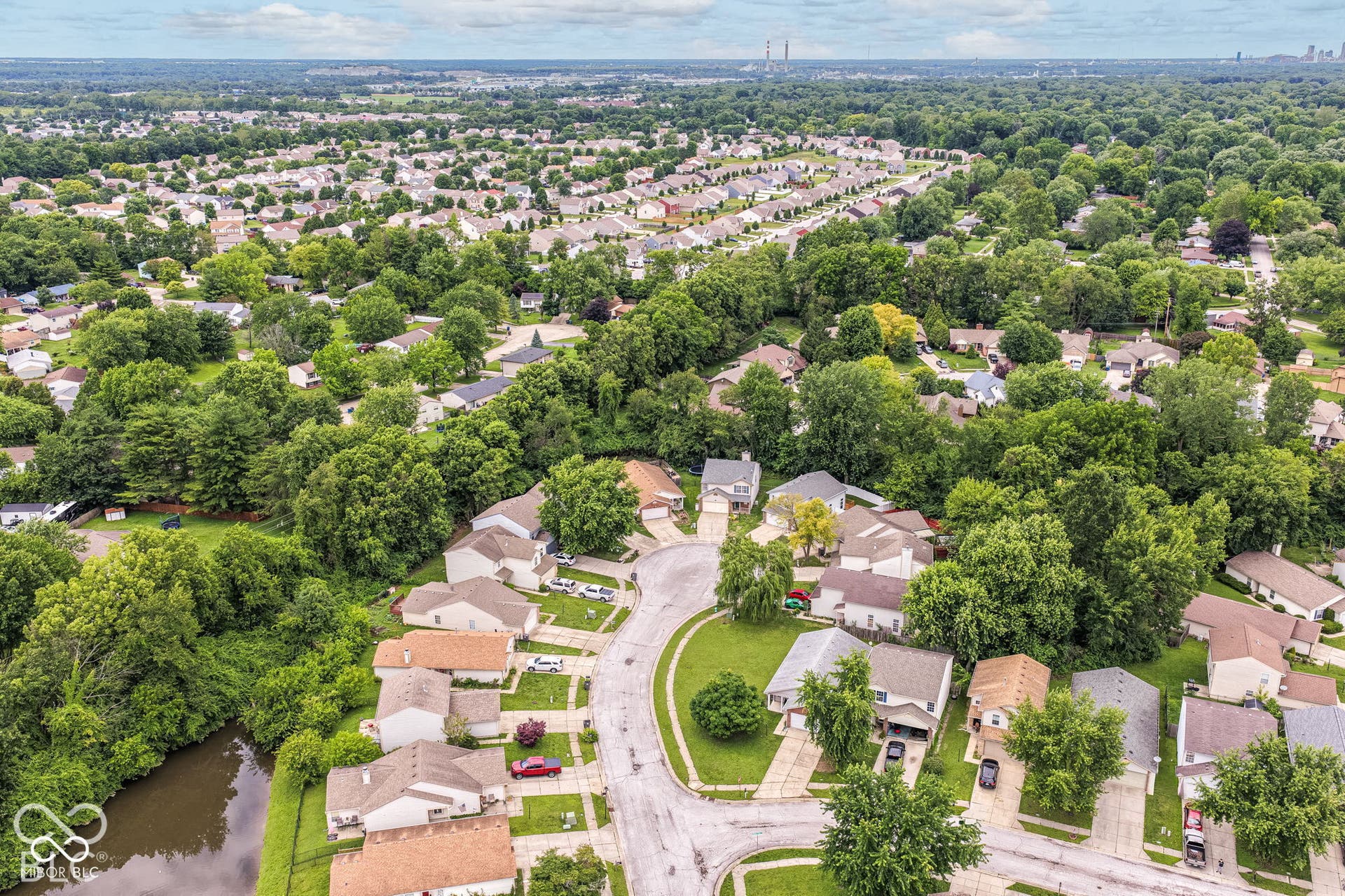 Expansive suburban neighborhood with dense tree coverage and residential housing