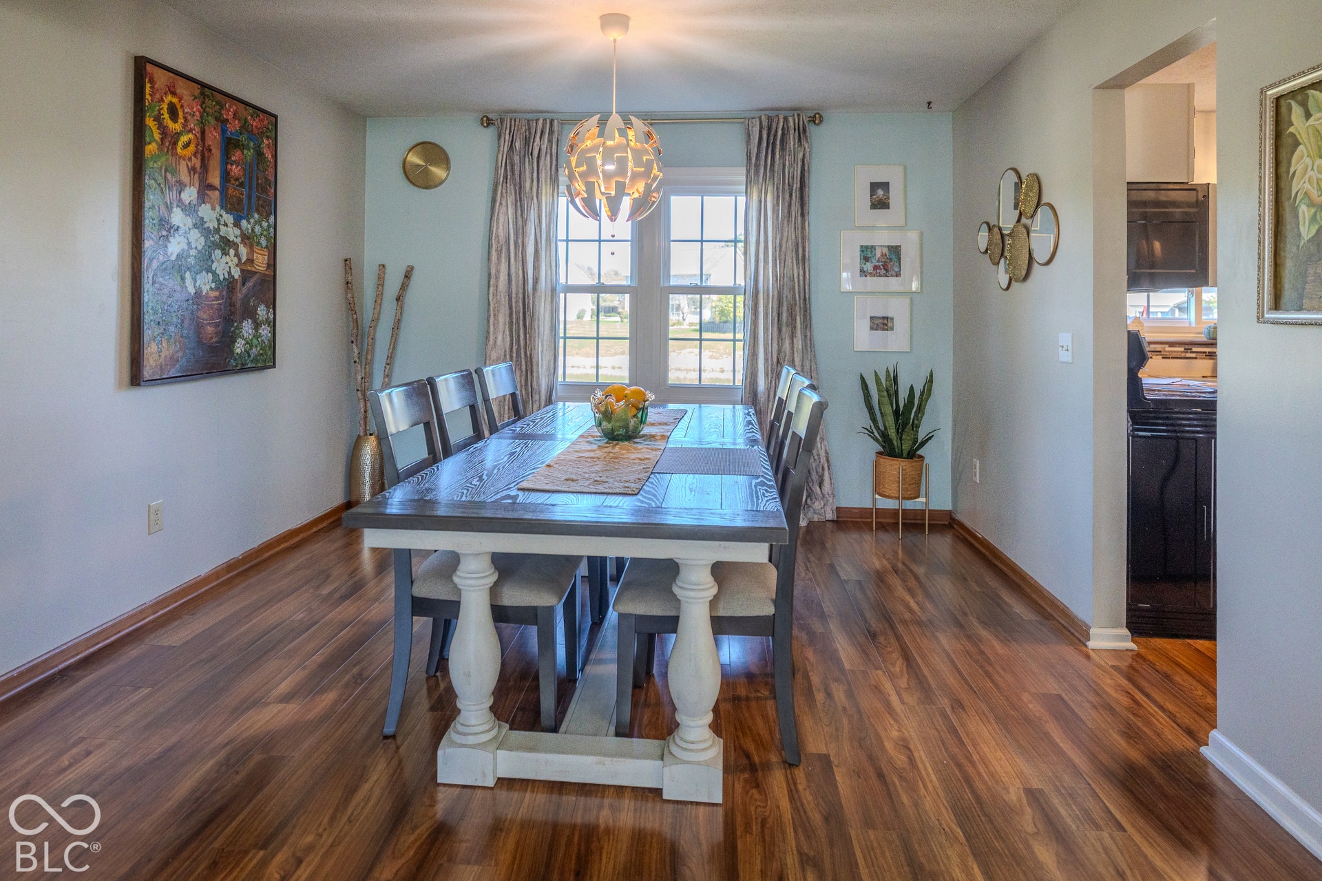 6416 Manchester Drive, Fishers, IN 46038 The dining area offers plenty of room for large Thanksgiving dinners and family gatherings, with expansive windows overlooking peaceful pond views and the fenced-in backyard-perfect for keeping an eye on the kids while enjoying time around the table.