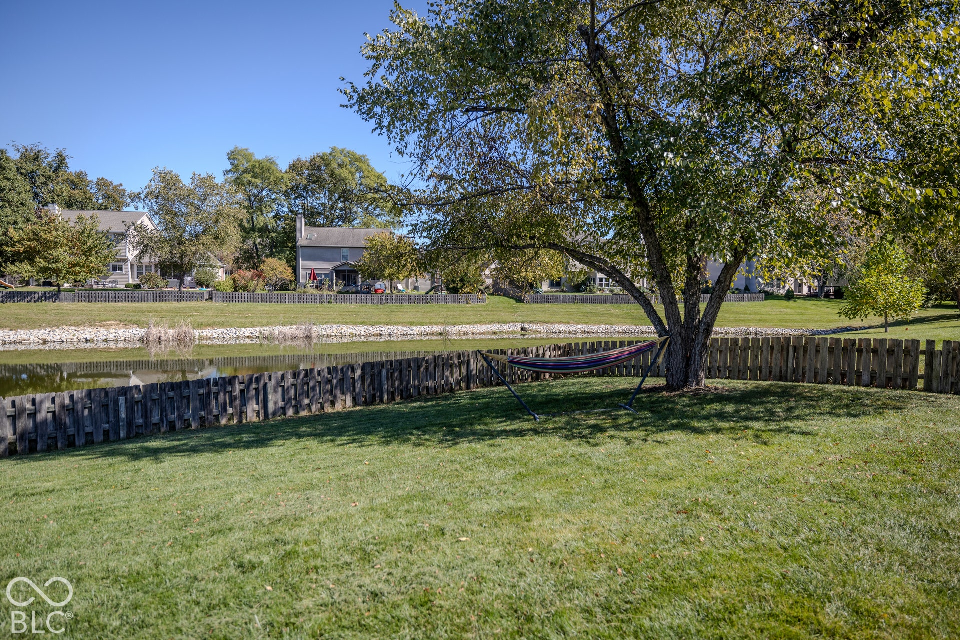 6416 Manchester Drive, Fishers, IN 46038 The spacious backyard offers plenty of room for all your outdoor activity and offers shade from a mature tree and great pond views.